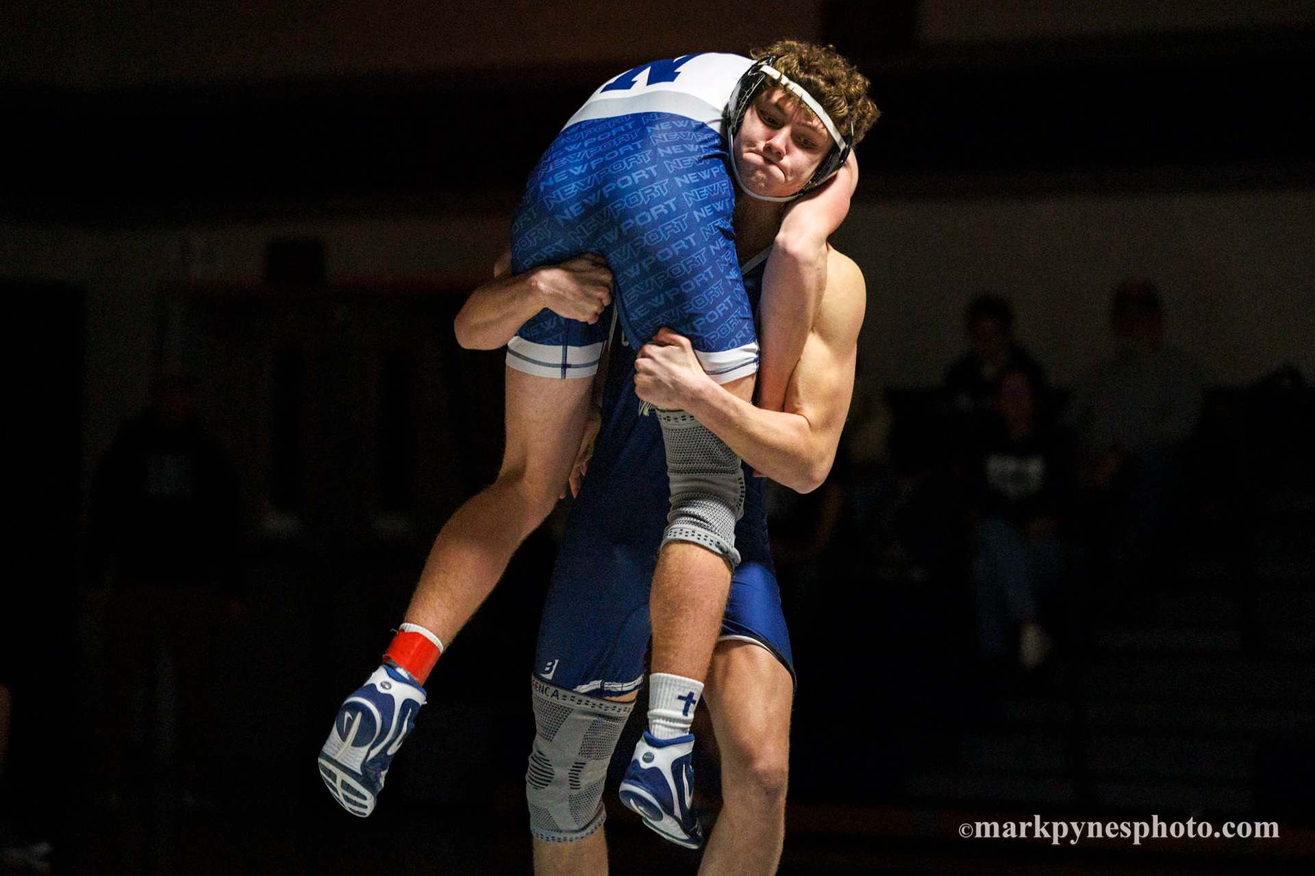 Asher Minium, Camp Hill, picks up Newport’s Trevin Arnold, in the 172 pound match, won by pin by Arnold in 4:51.