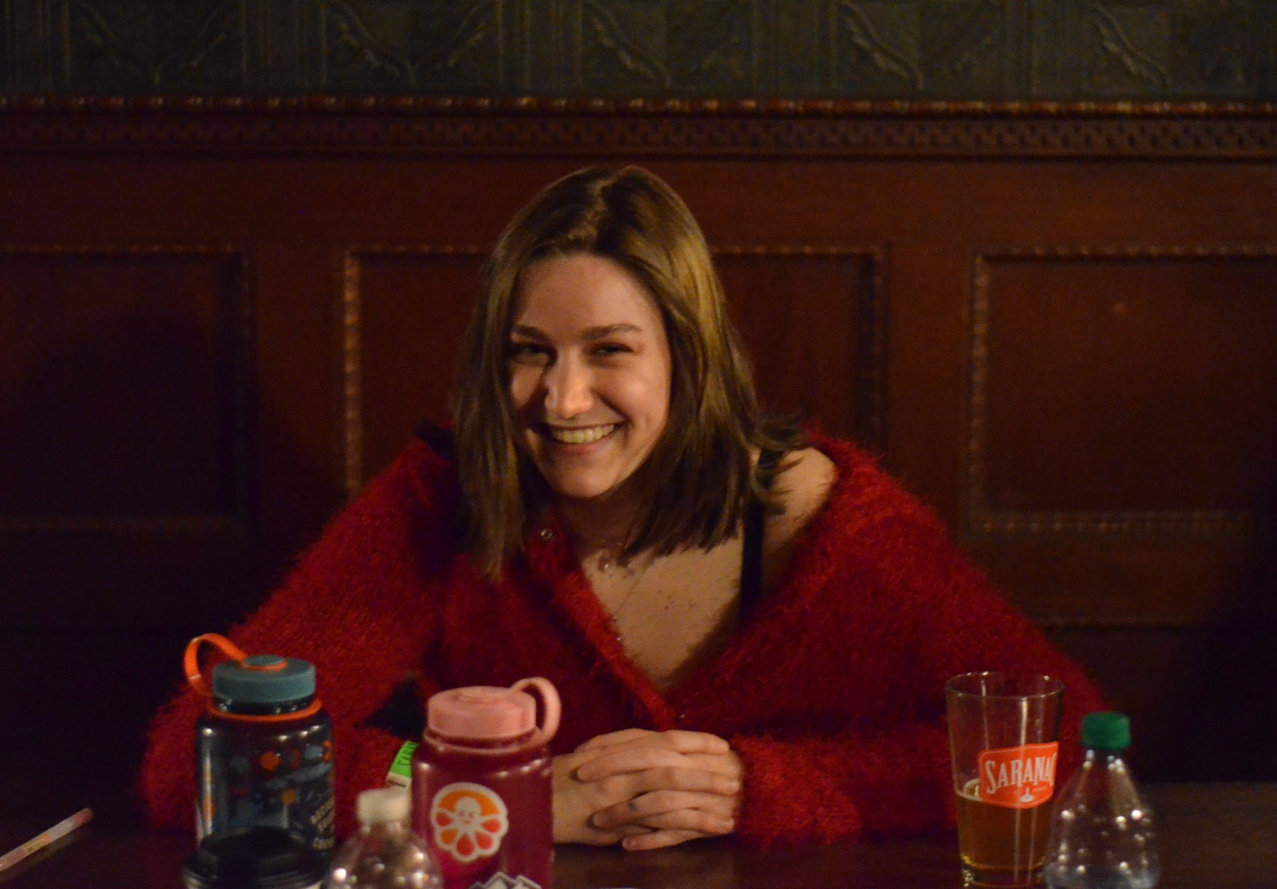 Jane, Art Director at the check-in table with a big smile (March 2019).