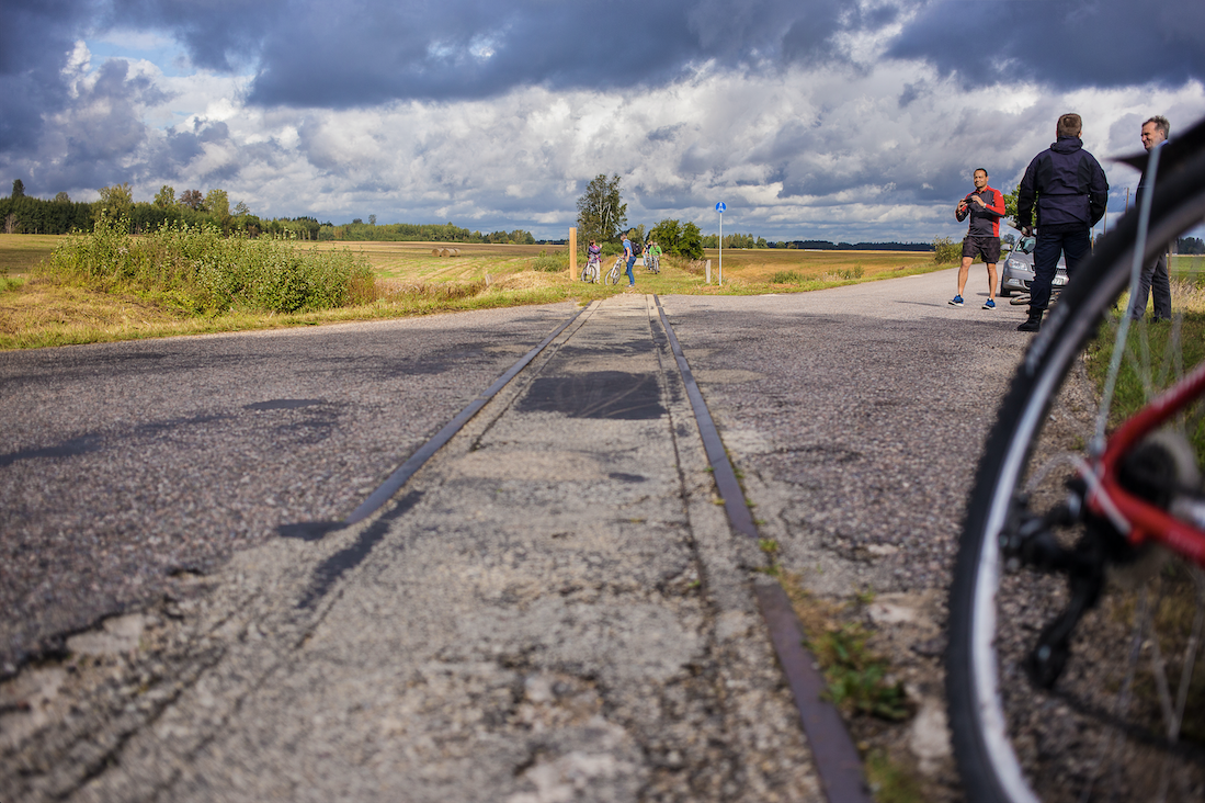 Narrow-gauge rails in asphalt near Dikļi