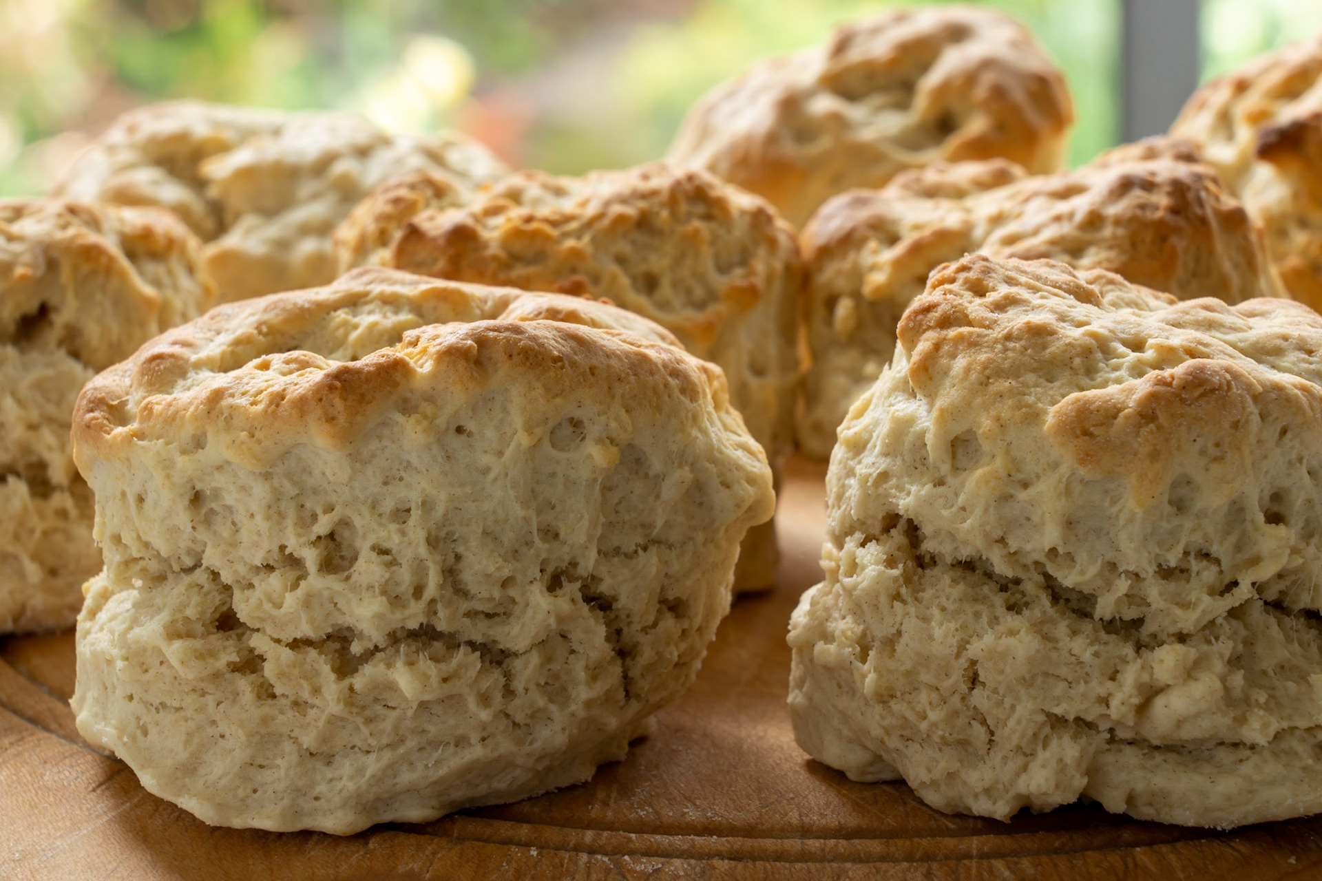 Closeup of homemade scones on a breadboard. Selective focus