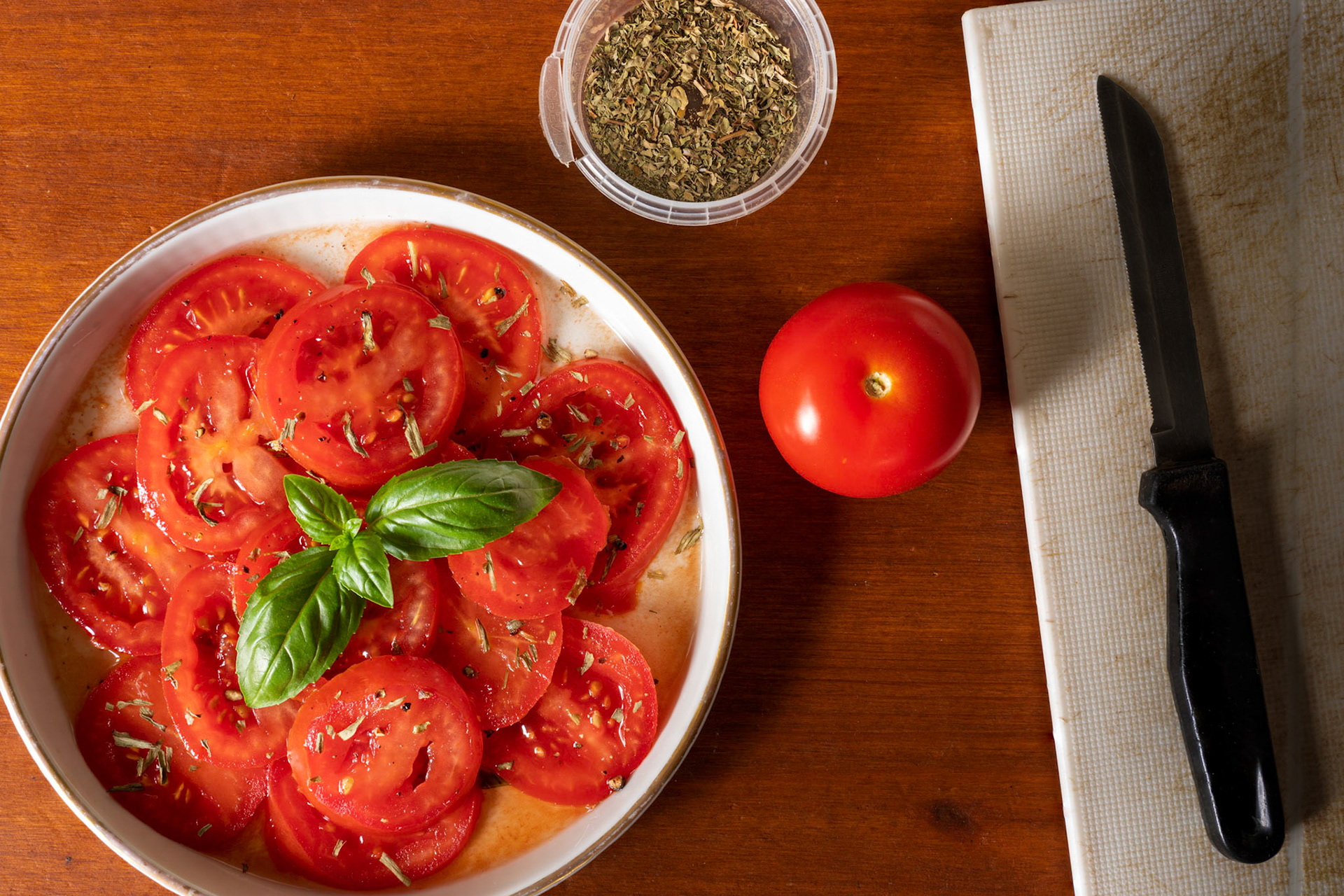 Tomato salad with tarragone and basil in red wine vinegar