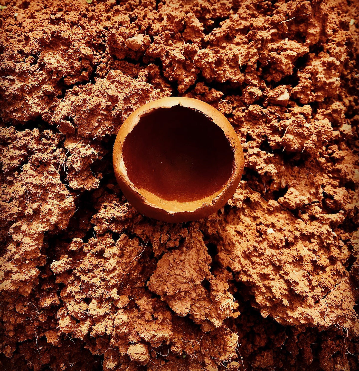 pinch pot upon raw soil
