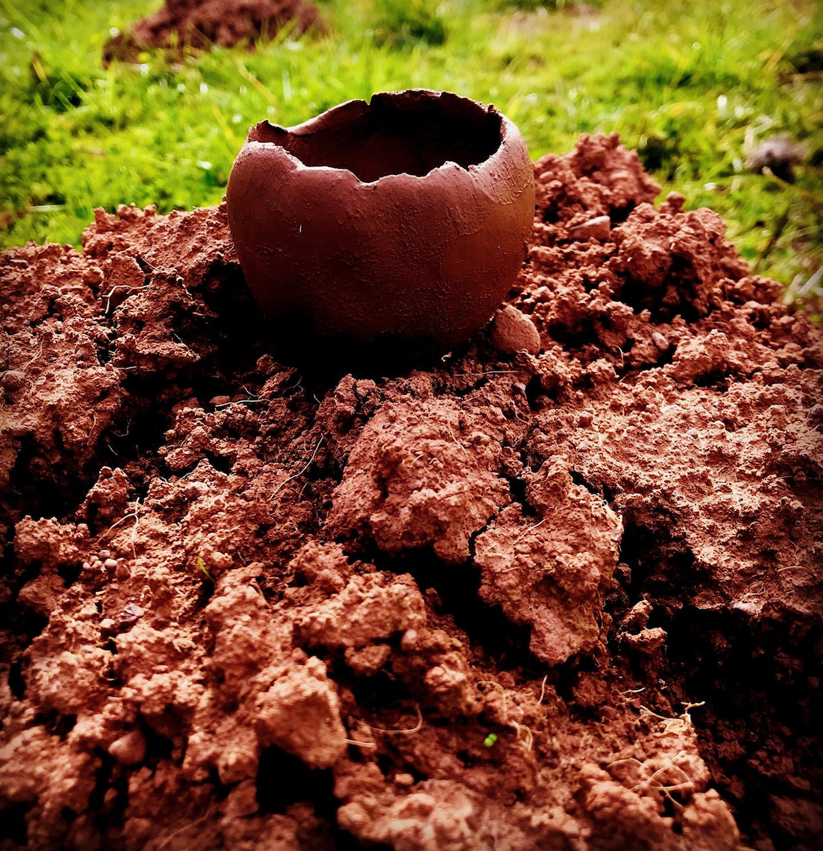 pinch pot upon raw soil