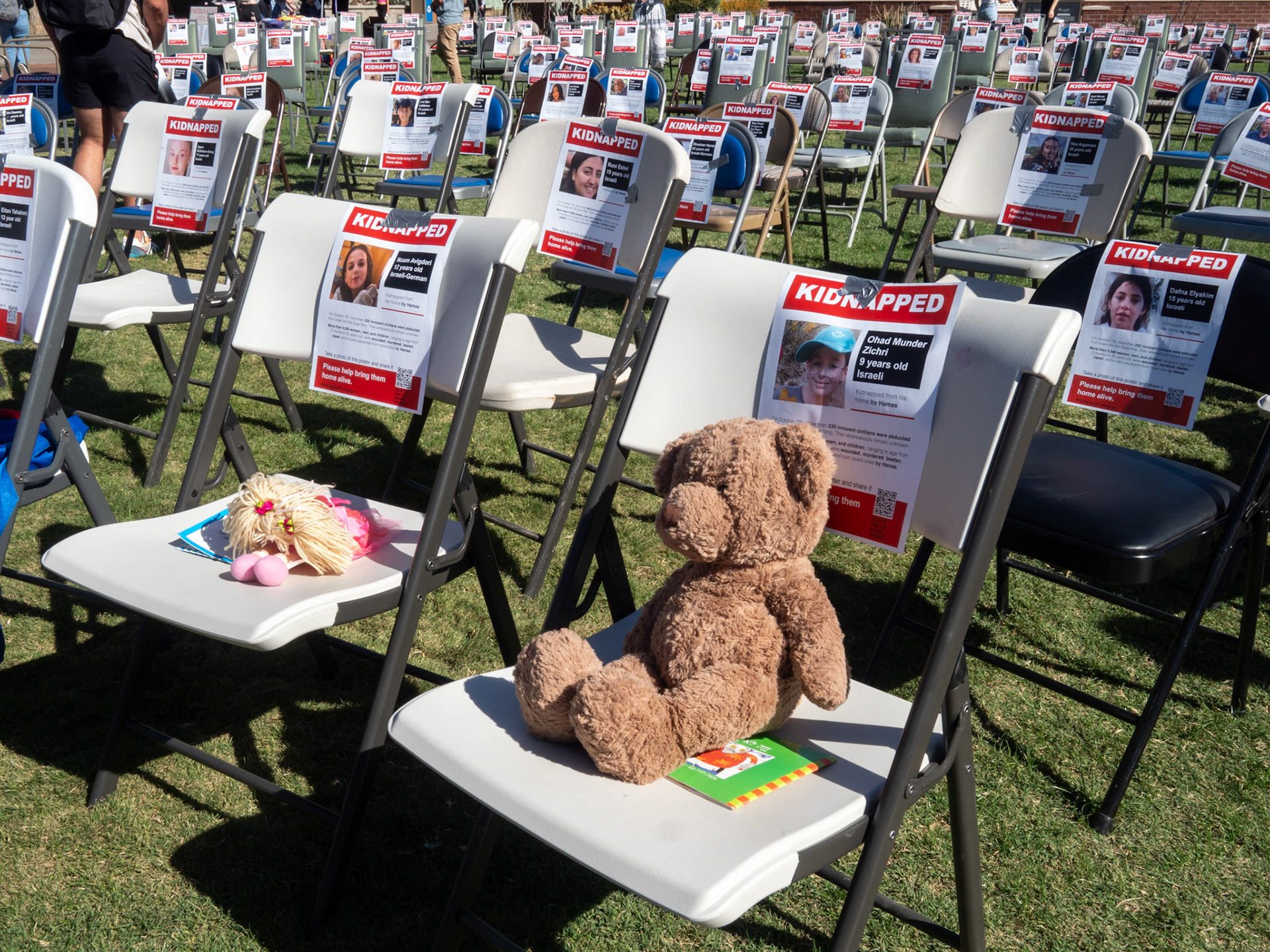 Signs at the Catpact and Israeli student Memorial on Nov 8 at the University of Arizona. The signs were up during a fair going on at the mall.