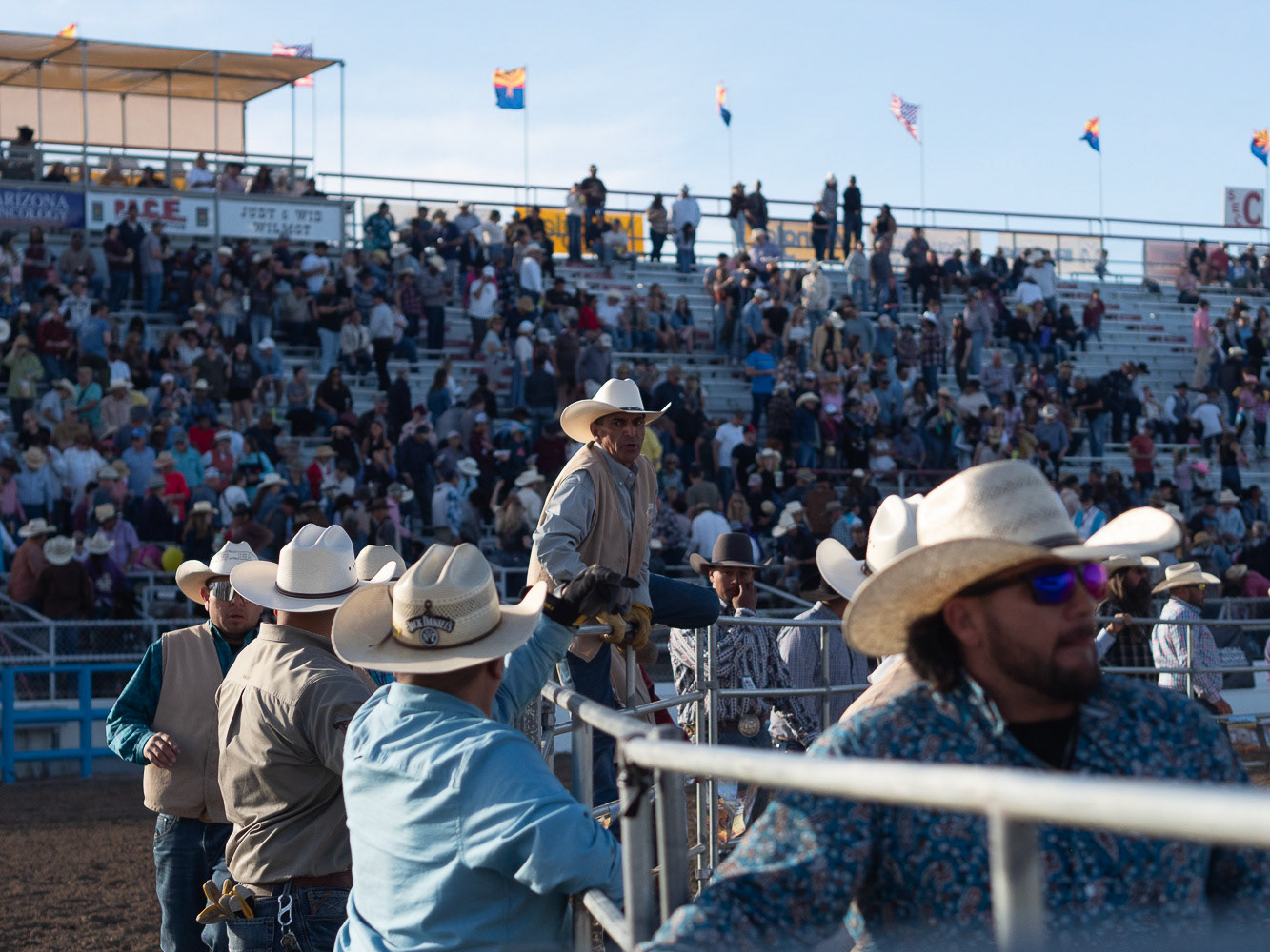 Workers putting fences back around La Fiesta de Los Vaqueros Tucson Rodeo on Saturday, February 17th, 2024, in Tucson Arizona. After the rodeo ended many helped to move the fences.