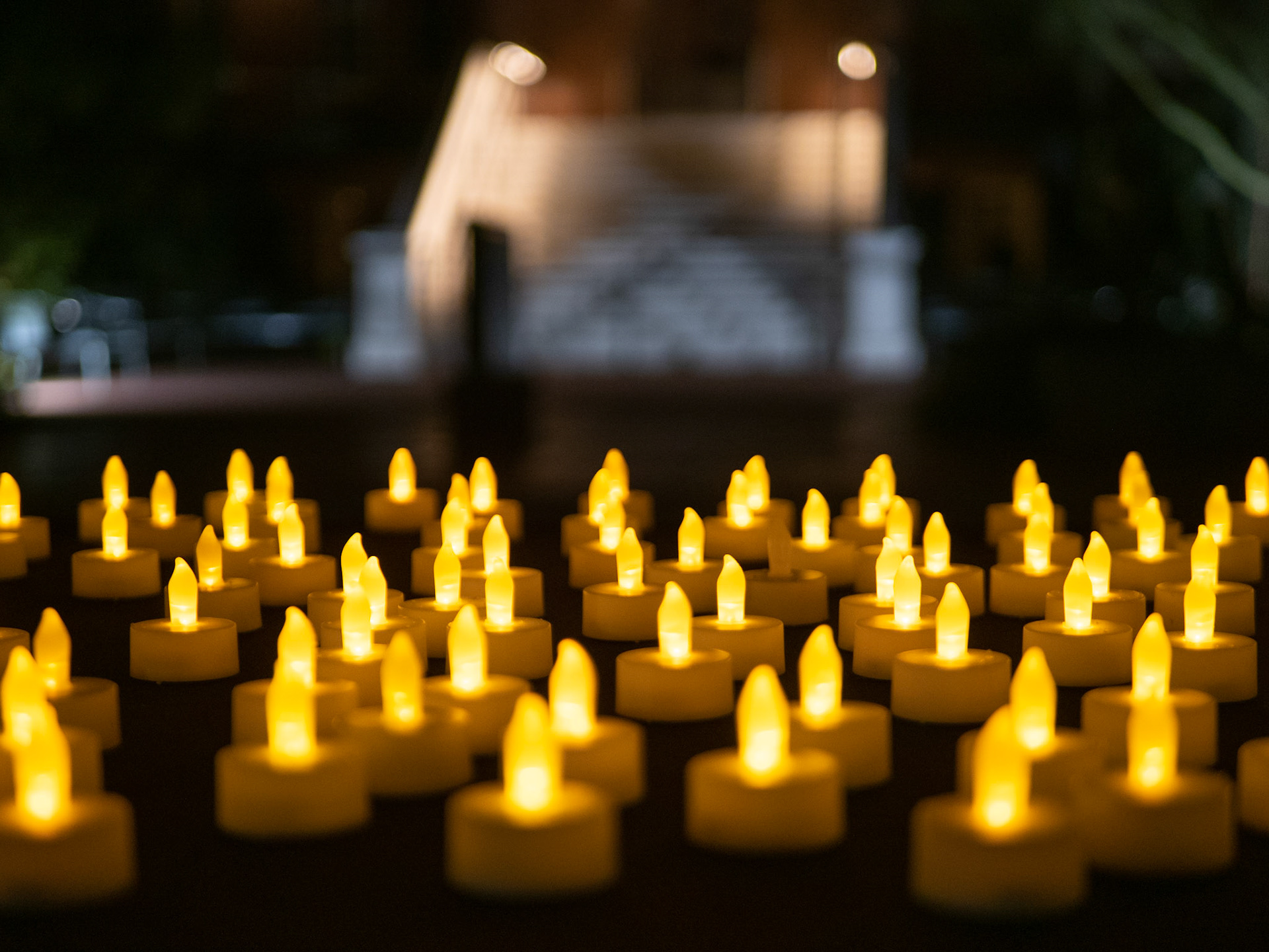 Candles laid out to grab before the Candlelight Vigil Honoring the Life of Dr. Thomas Meixner on October 7th.  The vigil took place at old main on the University of Arizona Campus.
