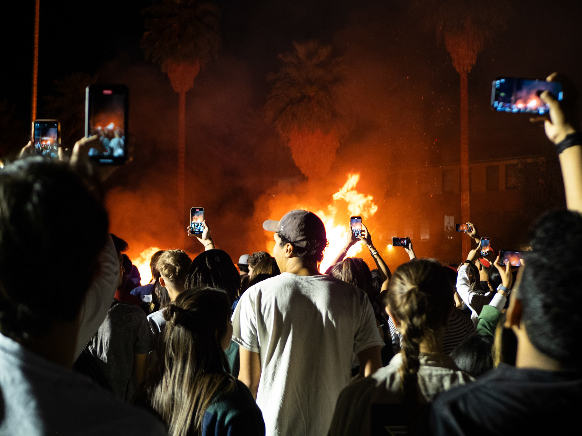 The Crowd taking photos of the Bonfire at the Homecoming Bonfire and Royalty Crowning at 7 p.m. on Nov. 3 on the West side of Old Main. After getting crowned the bonfire was lit, celebrating the ceremony.