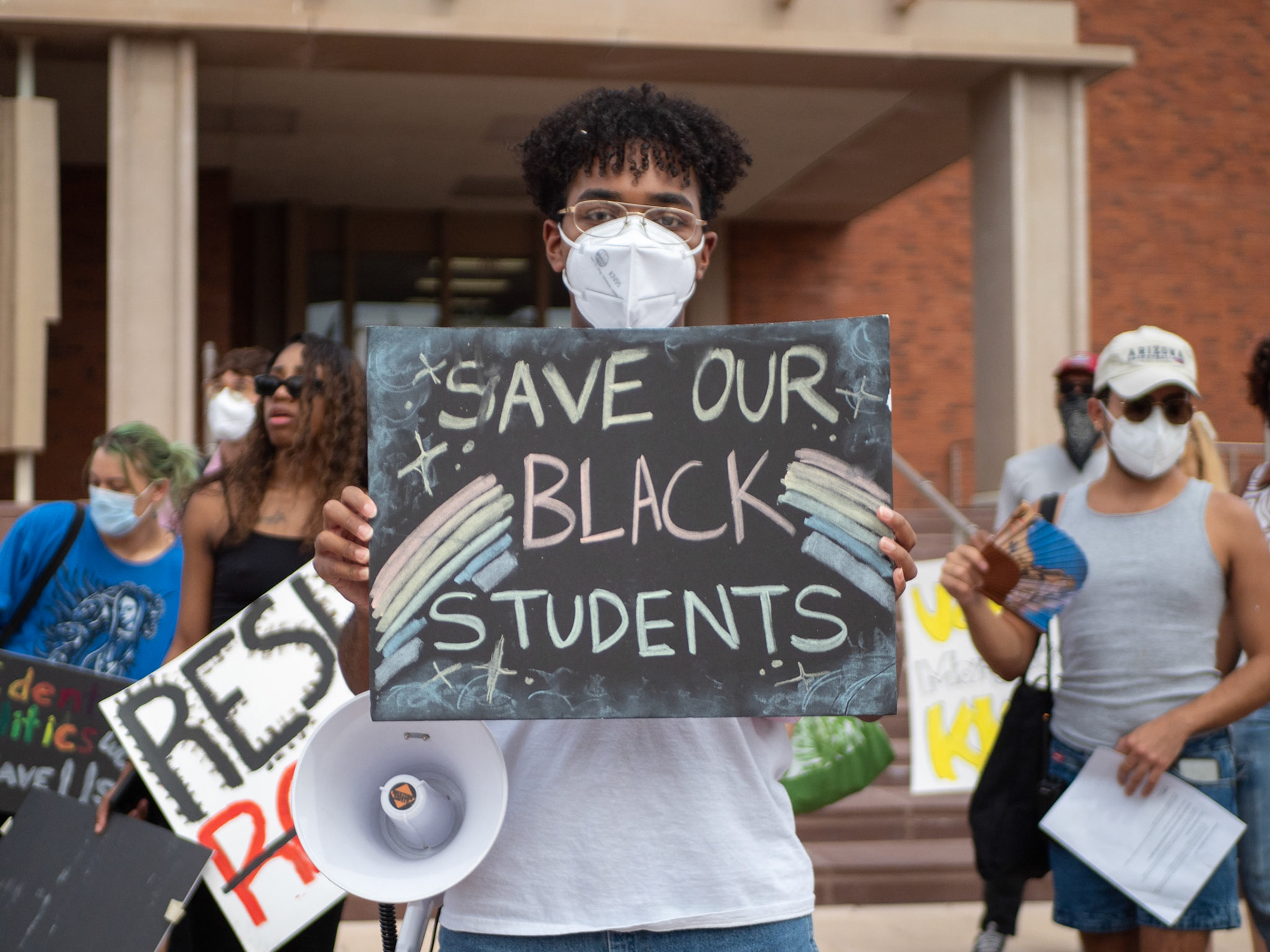A protester holding a sign at the Decrimilize Black Bodies March and Protest on Friday October 14th at 11:30. The protest took place at 11:30 and was run by the Coalition of Black Students and Allies.