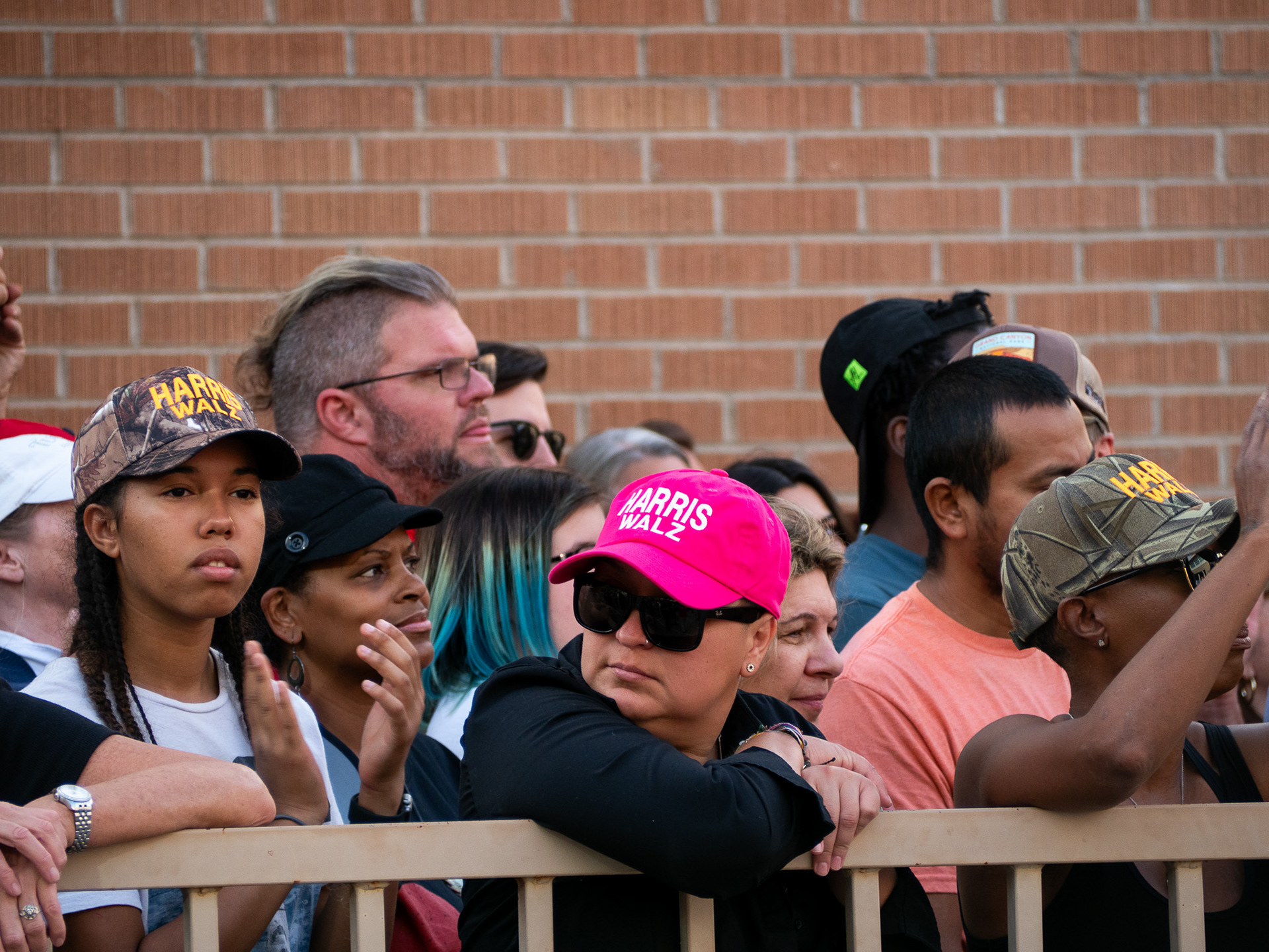 A person wearing a hat at and a pride flag at the Tucson Pride Parade on Sept. 28, 2024, in Armory Park. There were many different types of parade floats in the pride parade.