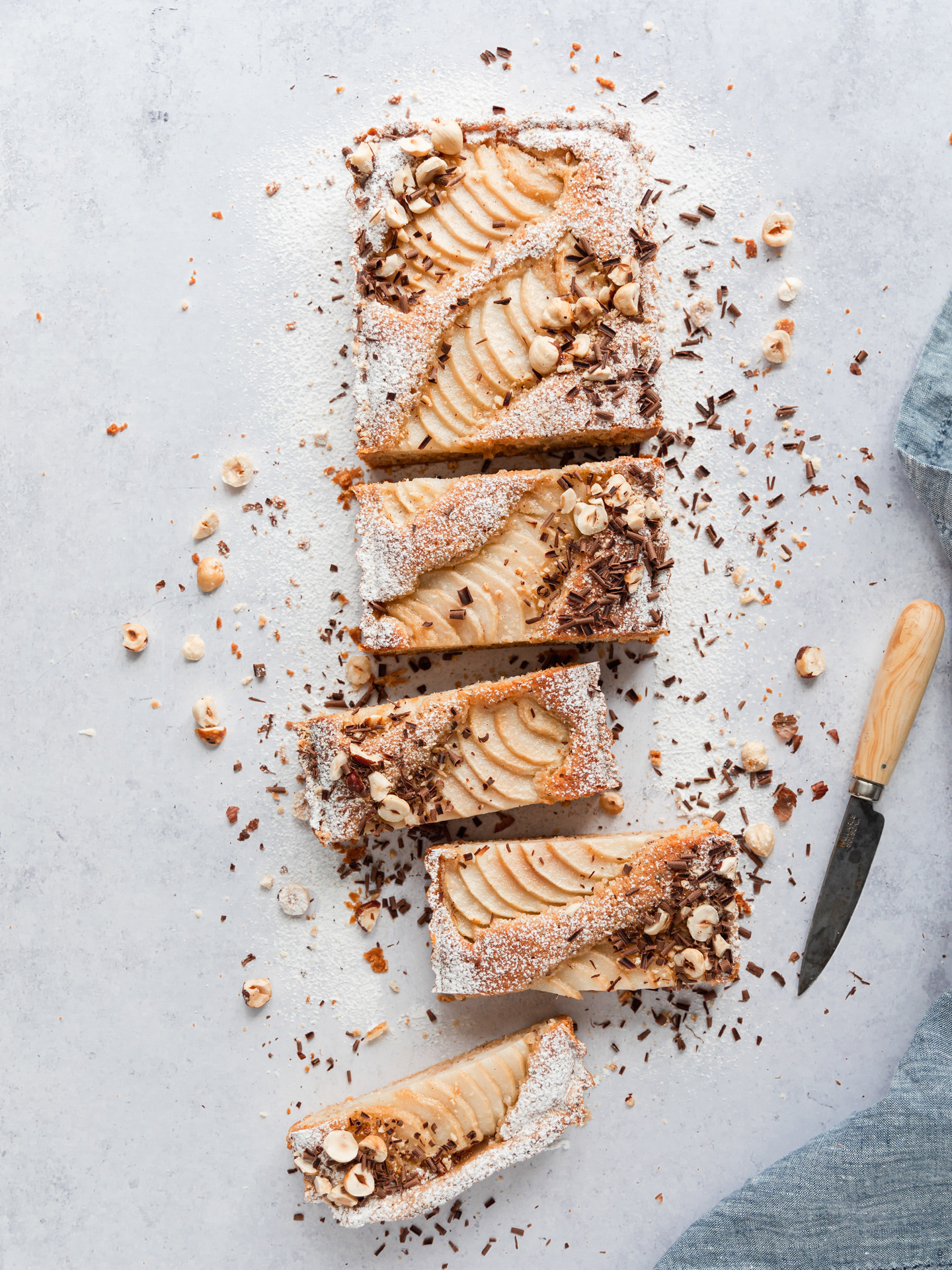 Pear and Hazelnut Frangipane Tart Image cut into pieces and styled by Ioana Ursu Photographer and Food Stylist based in West Midlands UK