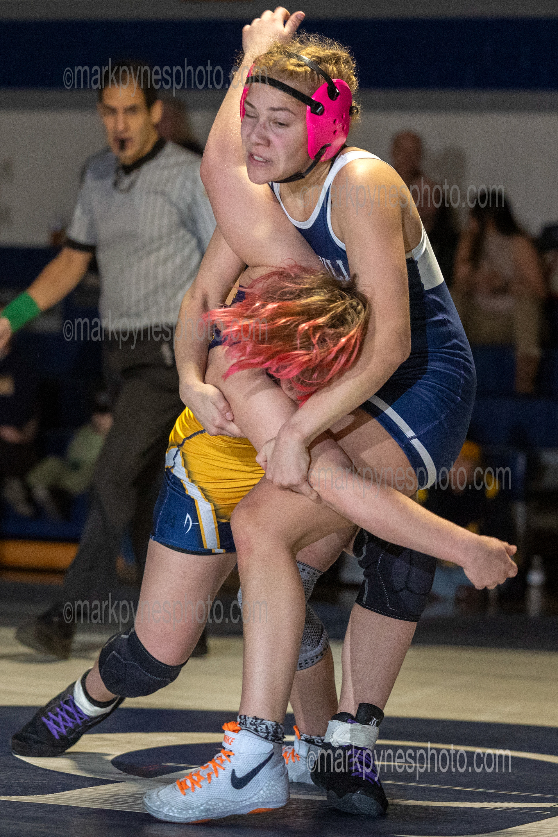 Alisha Hidalgo, Camp Hill’s 148-pounder fights off Upper Perkioman’s Adria Page on the way to a pin at 1:51.