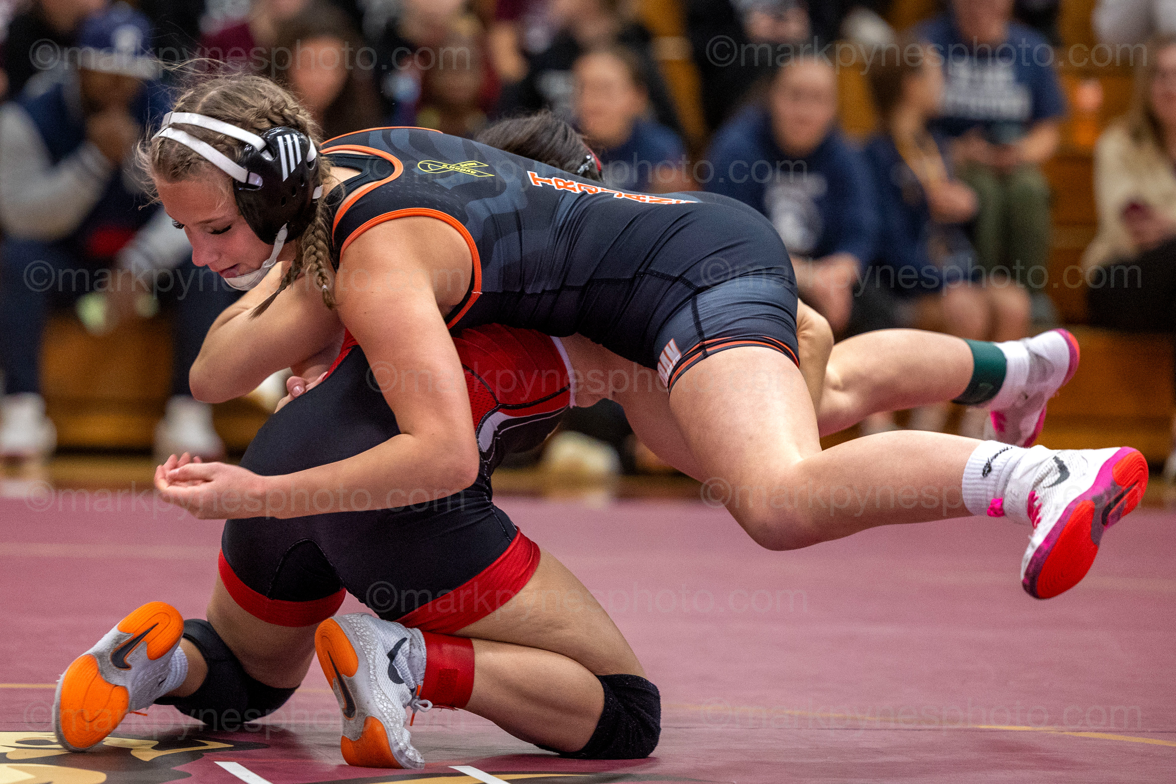 Journie Rodriguez, J.P. McCaskey, lifts York Suburban’s Alysiana Price-Ierley in the 112-pound final.