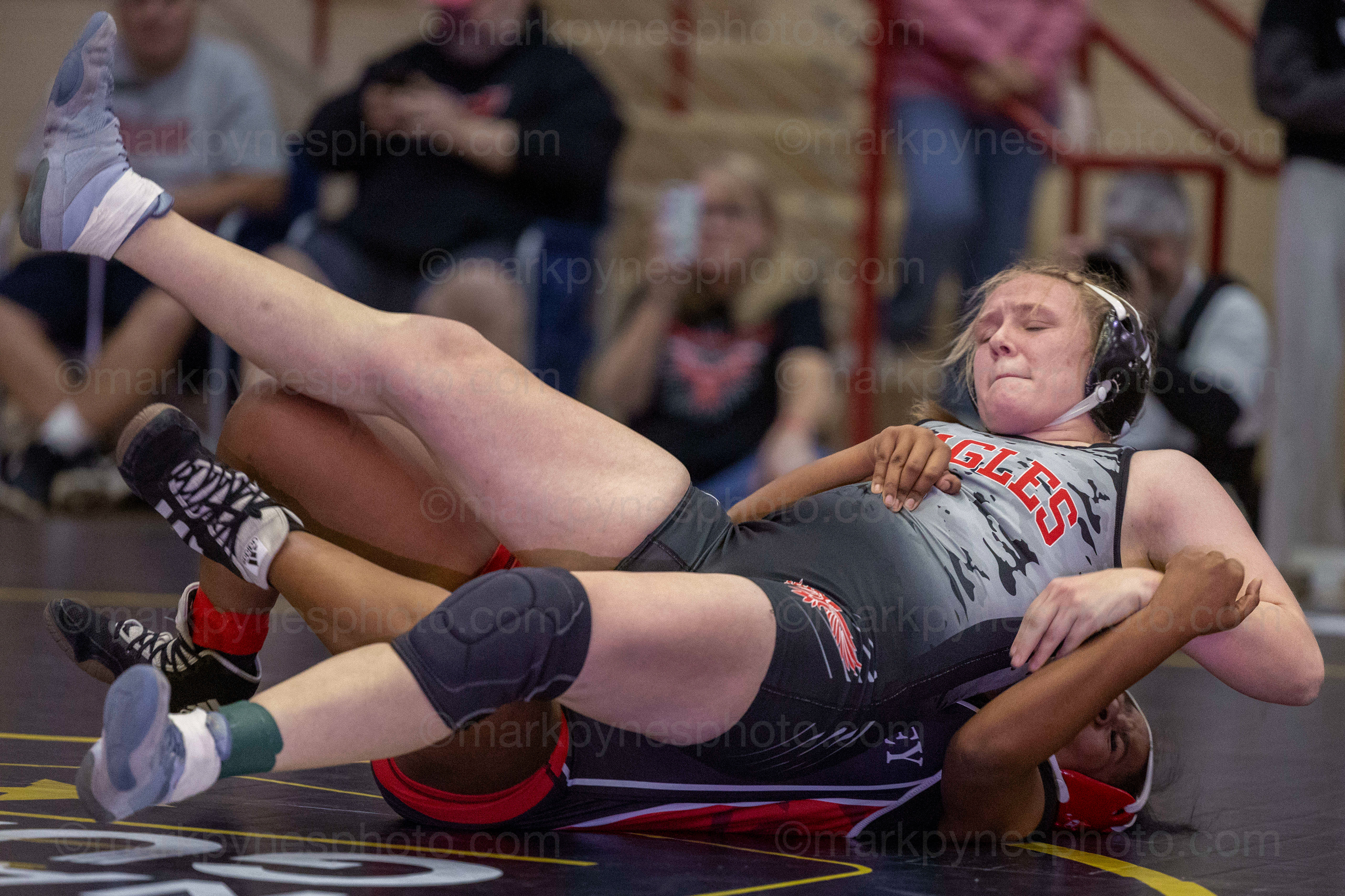 Myah Mulgrew, Cumberland Valley, pushes back into J.P. McCaskey’s Kashmere Aguilera, in the 155-pound match.