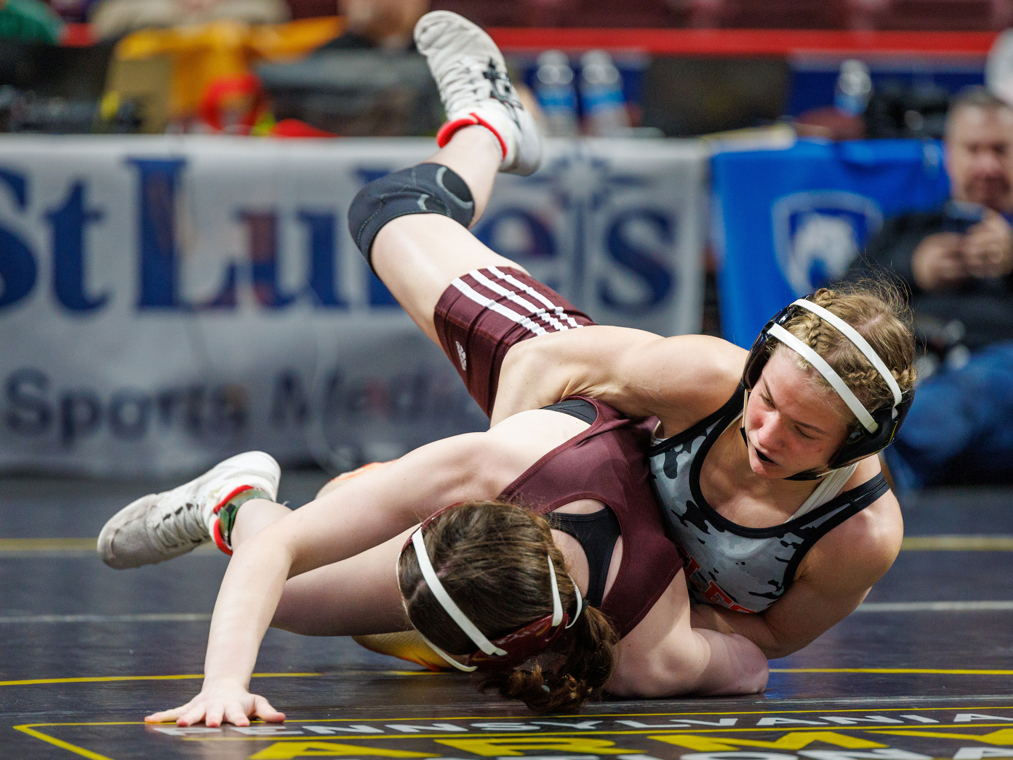 Eliana White-Vega pins Gracie Clift, Abington, in 0:25, in a 124-pound opening round match at the PIAA Girls Wrestling State Championships at the Giant Center in Hershey, Pa., Mar. 7, 2024.