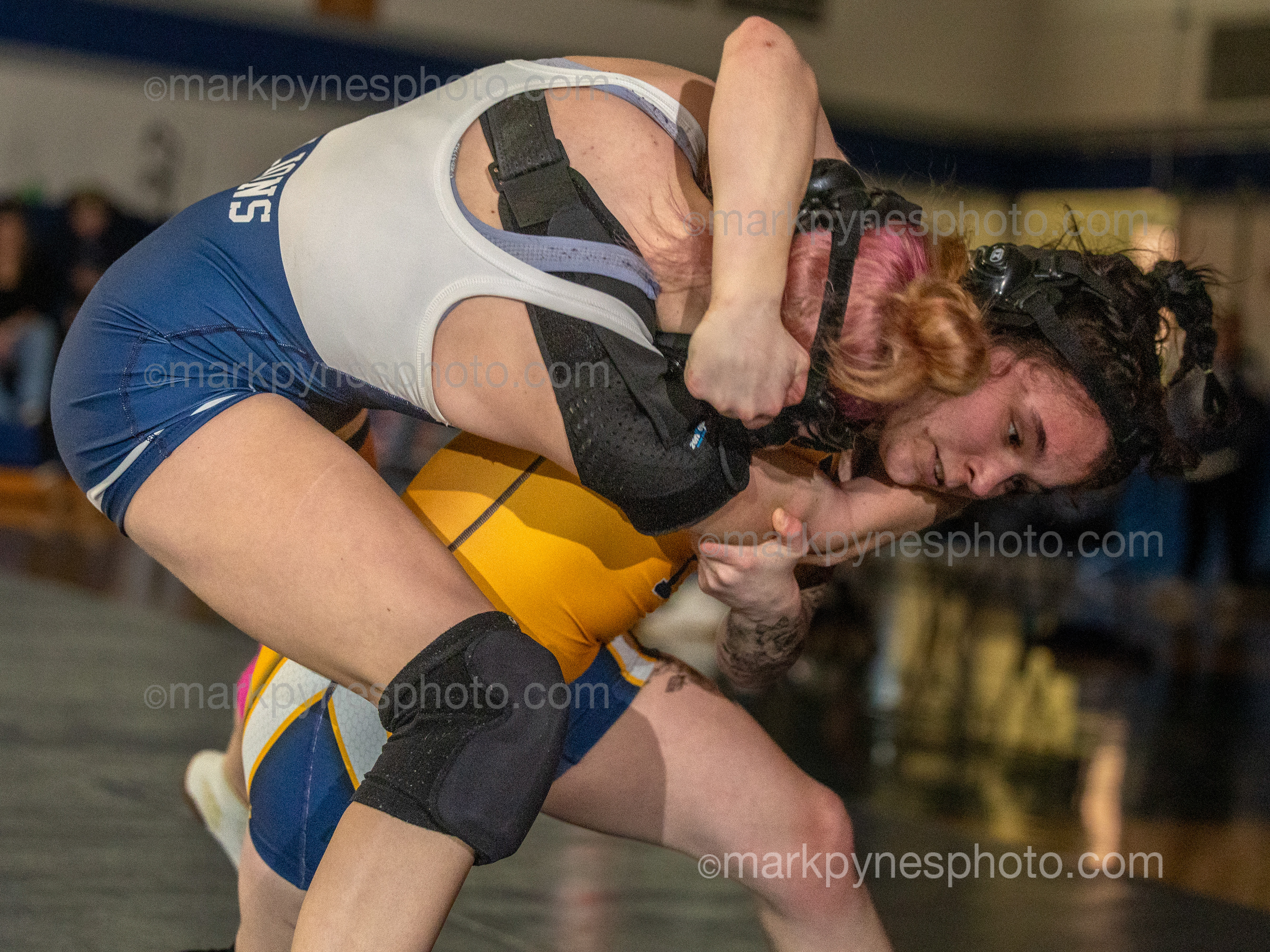 Heather Keim, Camp Hill, fights off Nadia Ventrella, Upper Perkioman, in the 112-pound match