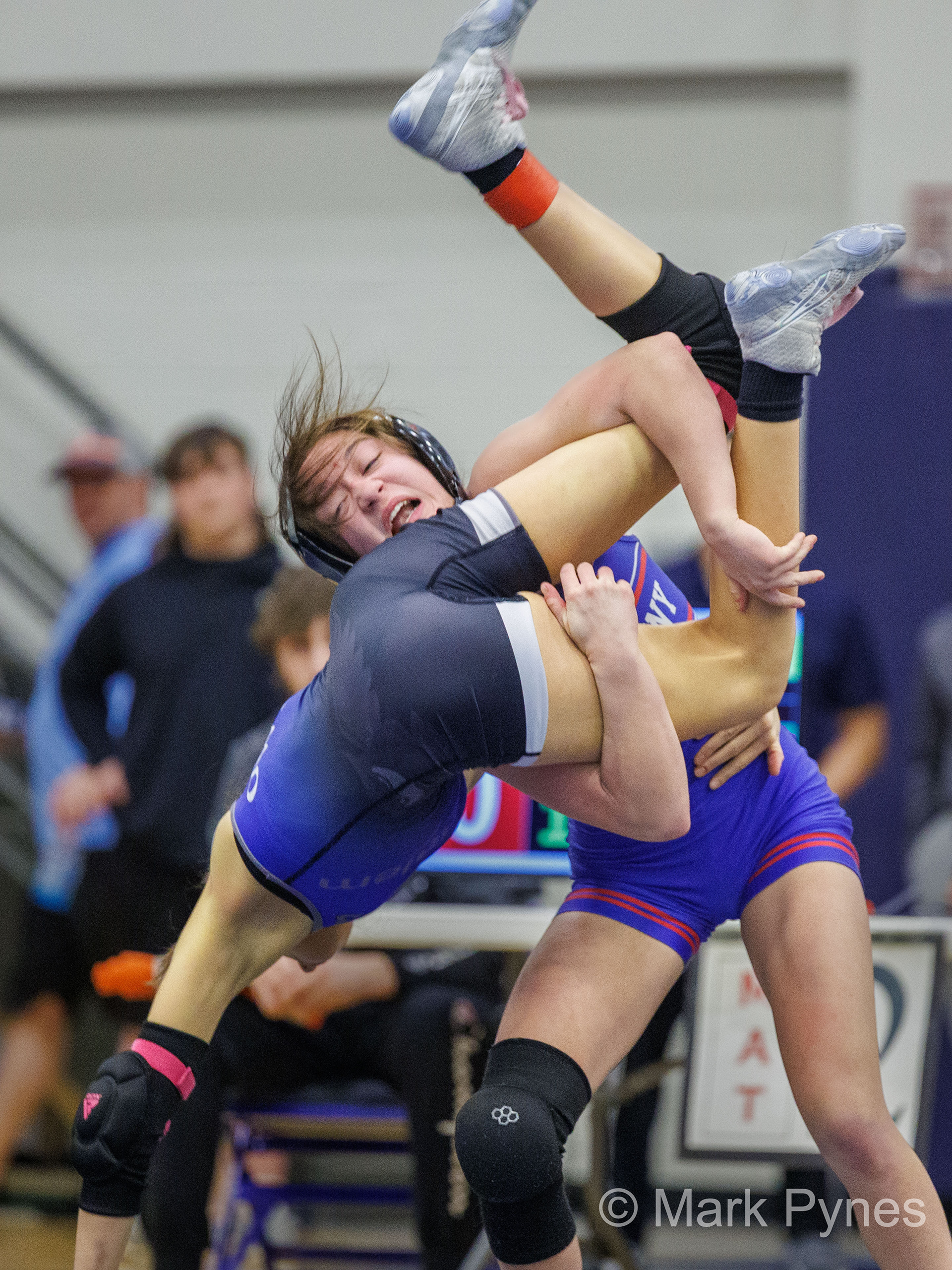 Grace Nesbitt (Neshaminy) throws Payton Hinkle (Bensalem), on the way to a pin at 1:57, in the 100-pound final at the South East Regional girls high school wrestling championship finals in Quakertown, Pa., Feb. 25, 2024.