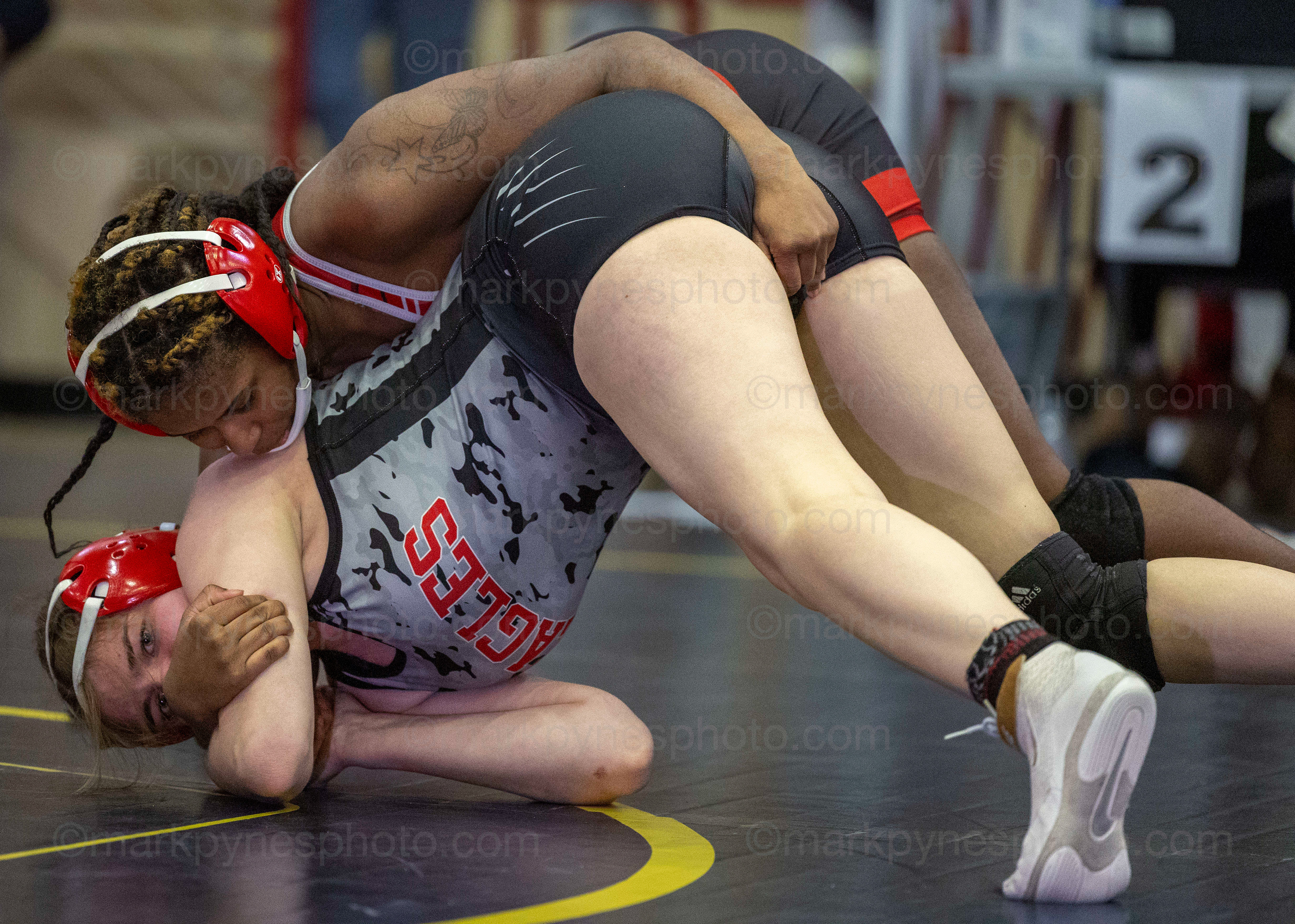 J.P. McCaskey’s Tyra Bookman rides Kendra O’Brien, Cumberland Valley, in the 148-pound match.