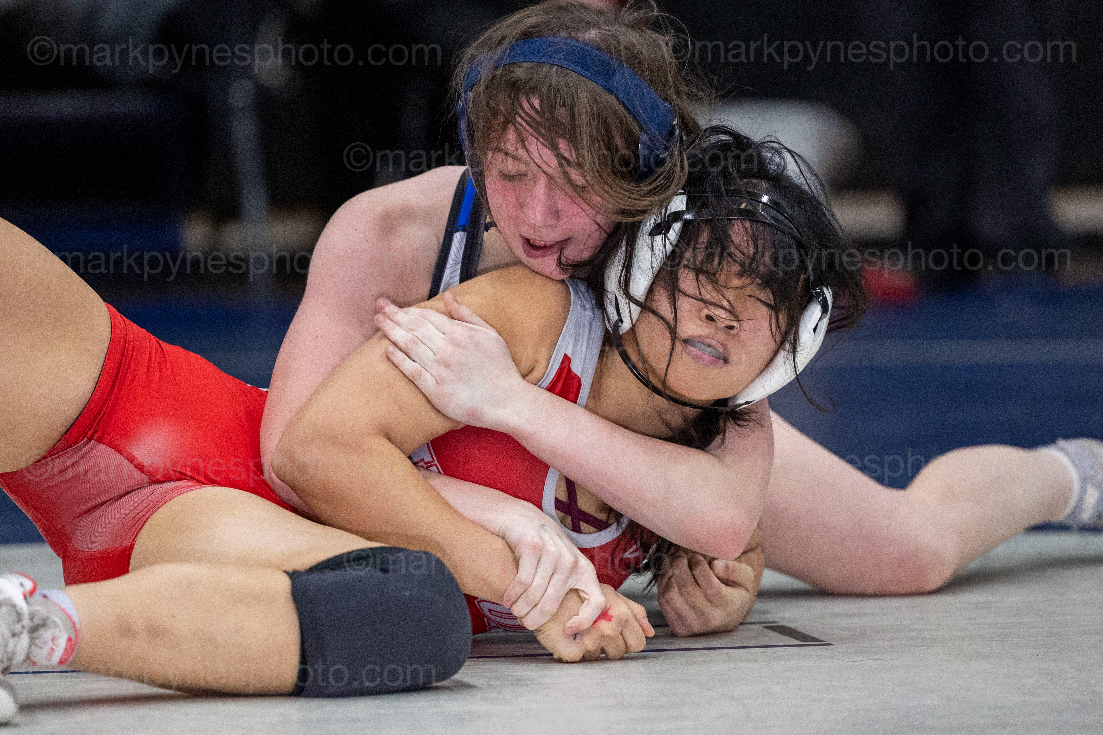 Lillienna Yohe, Spring Grove, controls Wilson’s Tammy Nguyen, on the way to a pin in the 142-pound final.