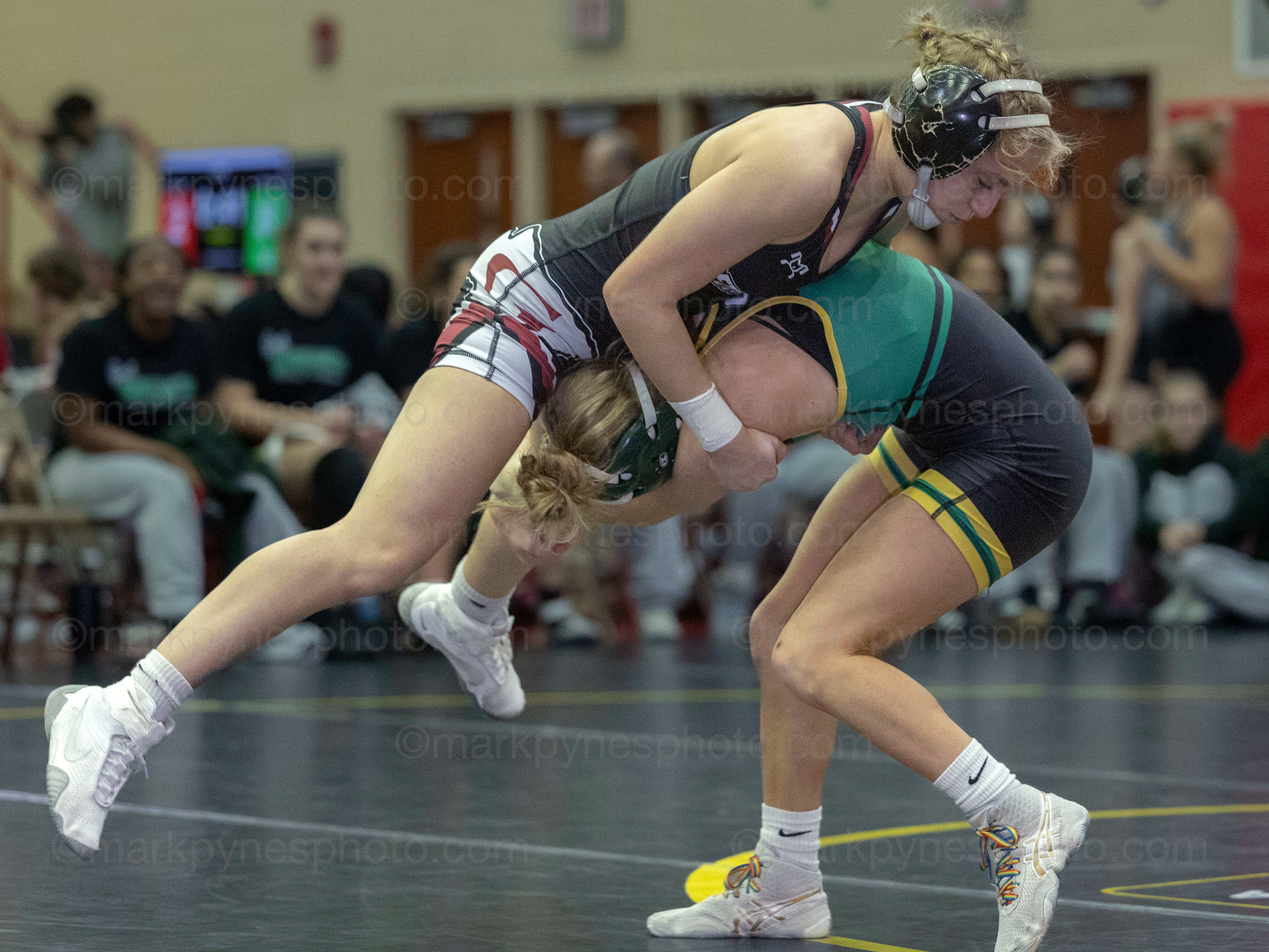 Gettysburg’s Taylor Keckler sprawls on Kate Hollinger, Central Dauphin, but loses an 8-7 decision.