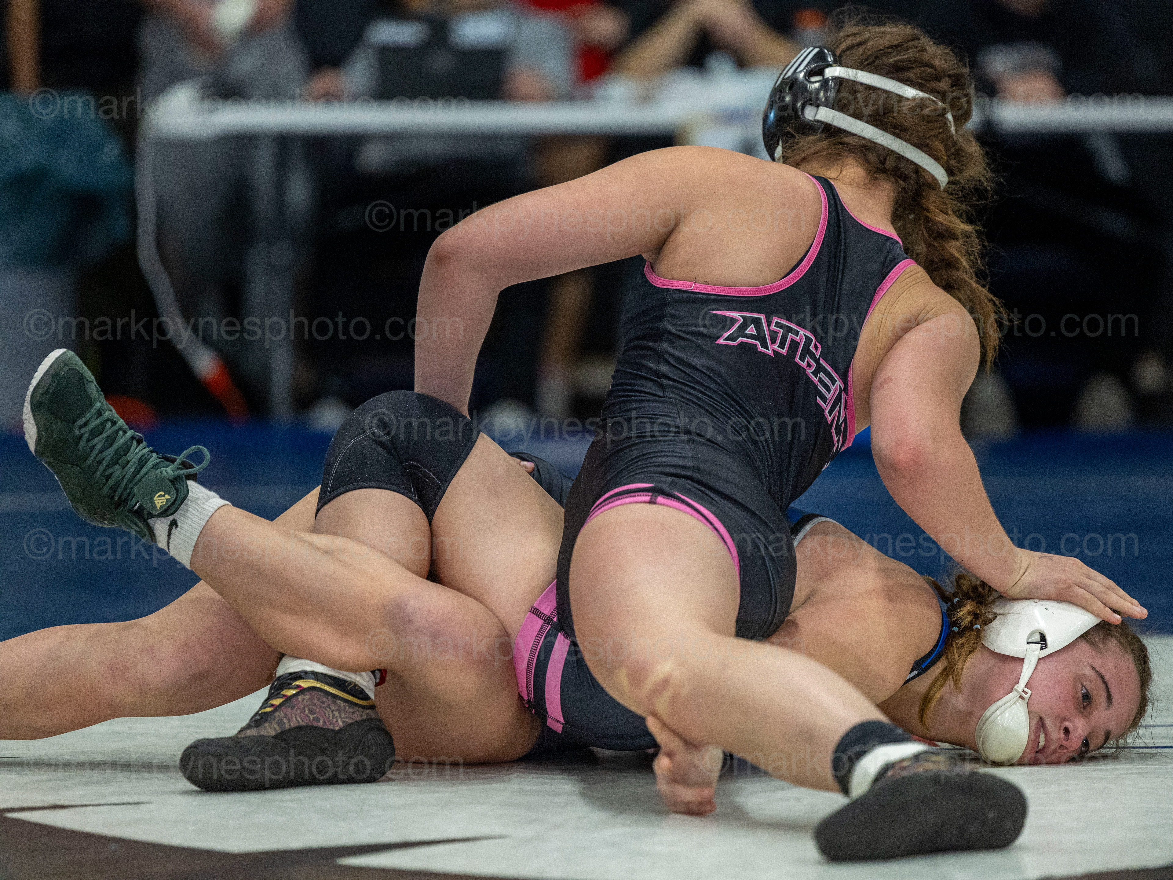 Hanna Rathbun, Athens, gets ready to pin Spring Grove’s Felicity Davis, in the 130-pound final.