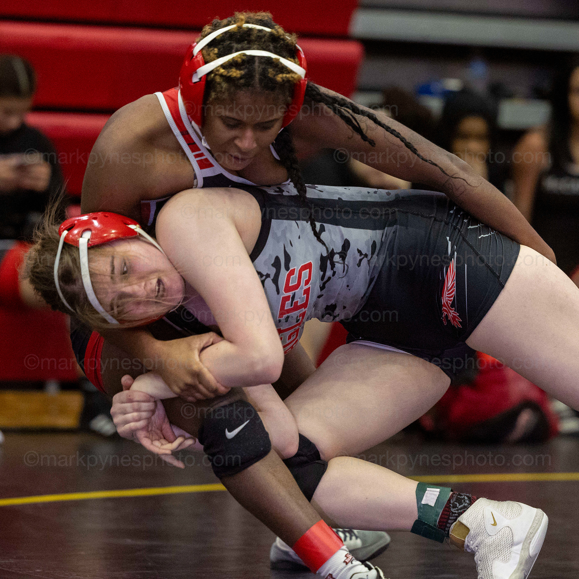 Kendra O’Brien, Cumberland Valley, drives into J.P. McCaskey’s Tyra Bookman in the 148-pound match.