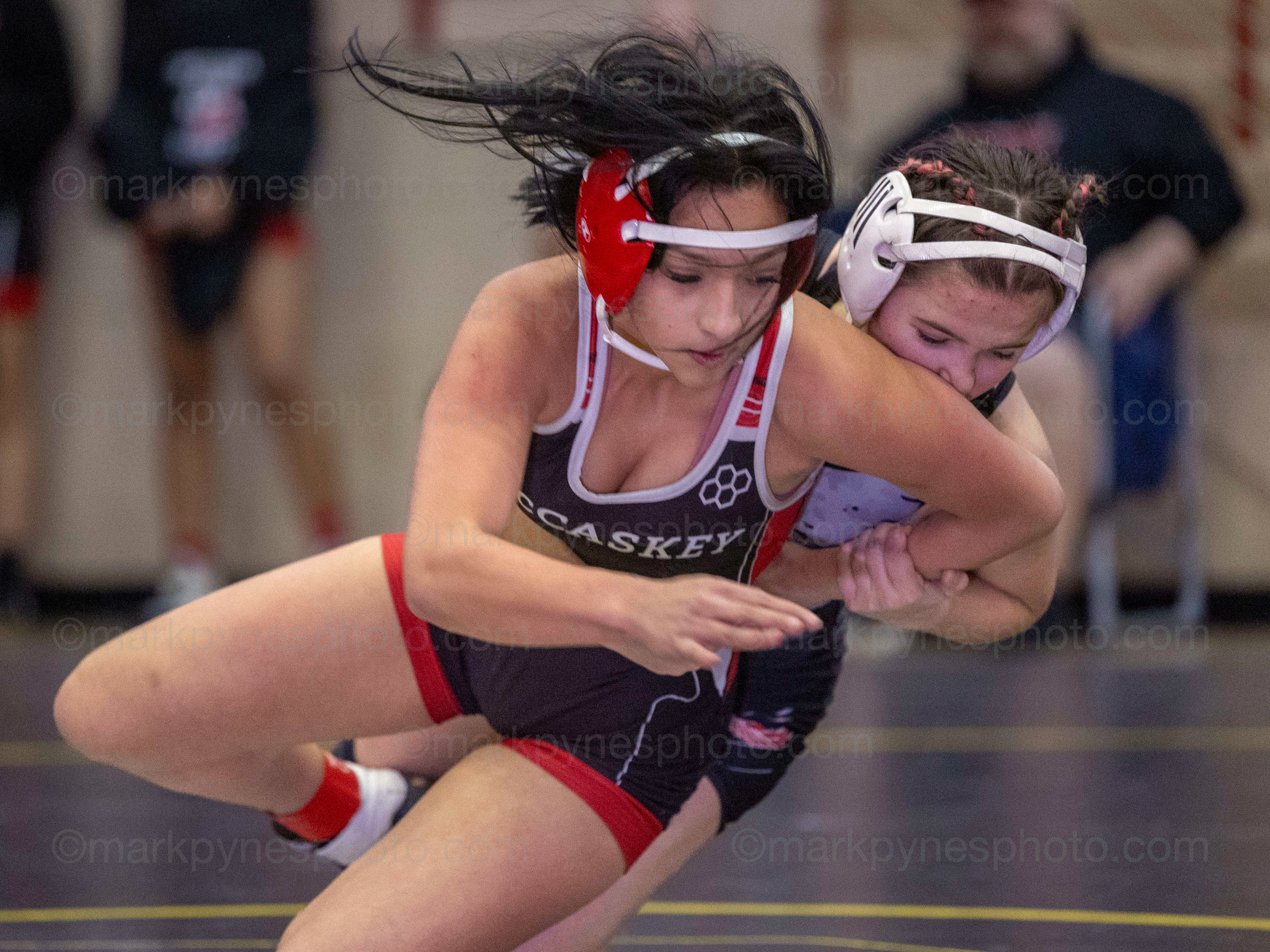 Jordyn Nailor, Cumberland Valley, takes down J.P. McCaskey’s Jazelyn Mendez in the 124-pound match.