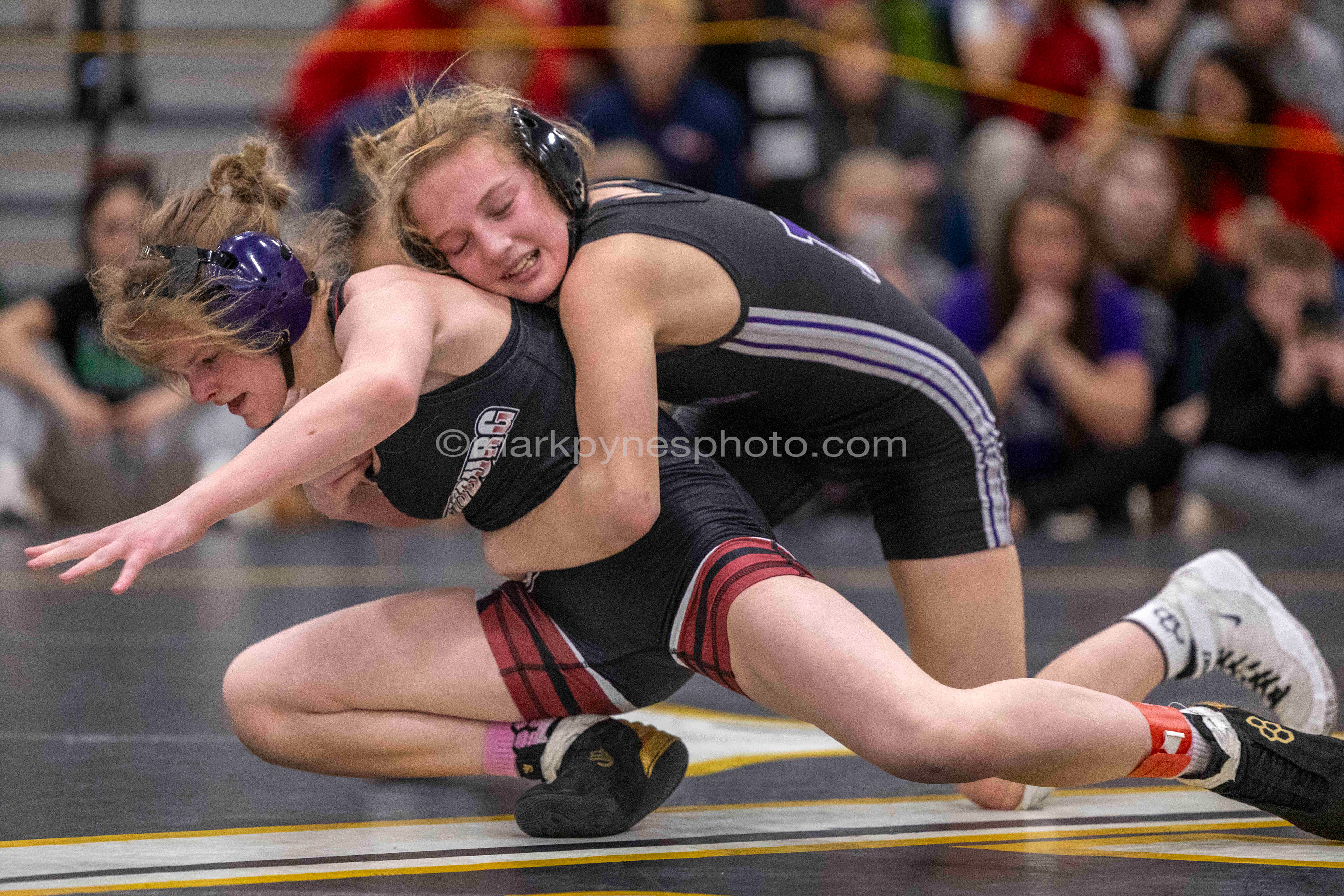 Brooklyn Henry, Gettysburg, is driven down by Makayla Smith, Northern York, in the 100-pound final, won 6-0 by Smith.