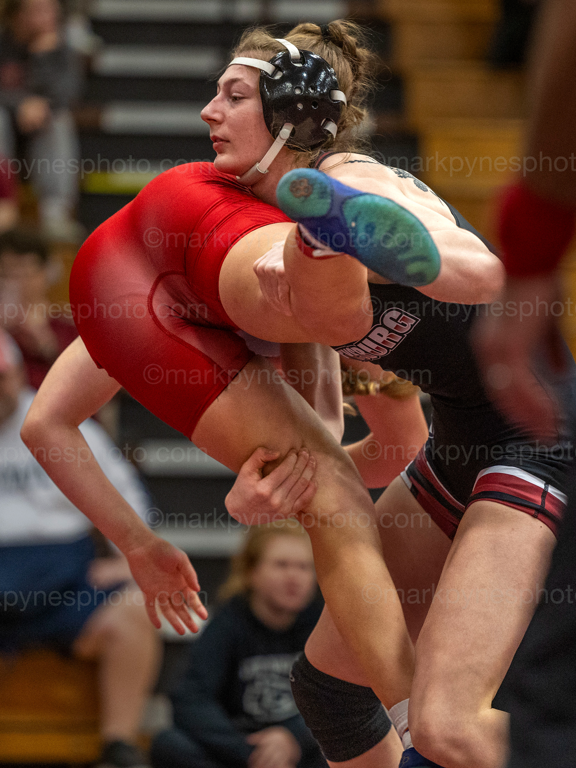 Zoey Haines, Gettysburg, picks up Pine Grove’s Geanna Lemke, on her way to a pin, at 49 seconds in the 142-pound final.