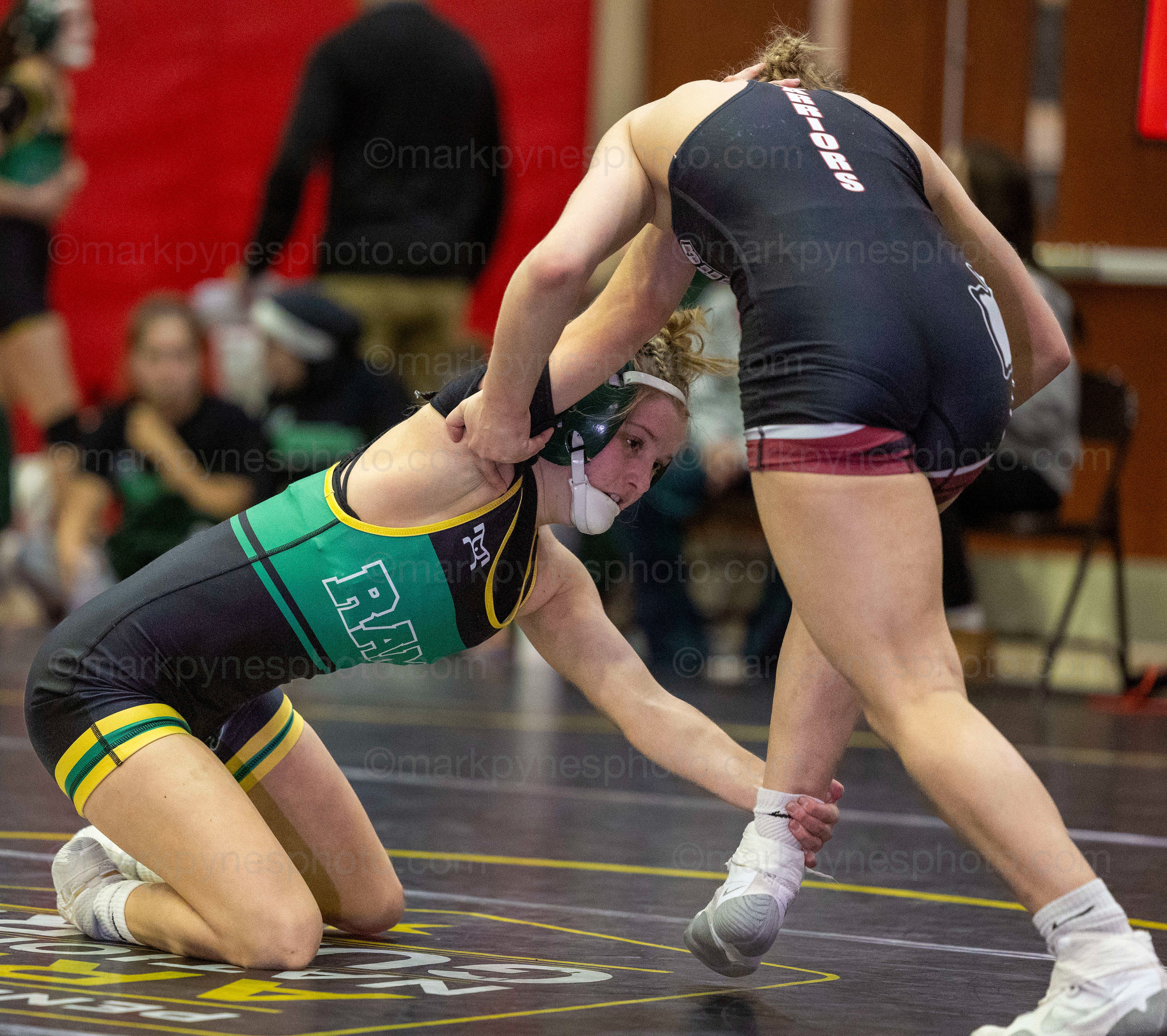 Kate Hollinger, Central Dauphin, grabs the ankle of Gettysburg’s 106-pounder Taylor Keckler, on her way to an 8-7 decision.