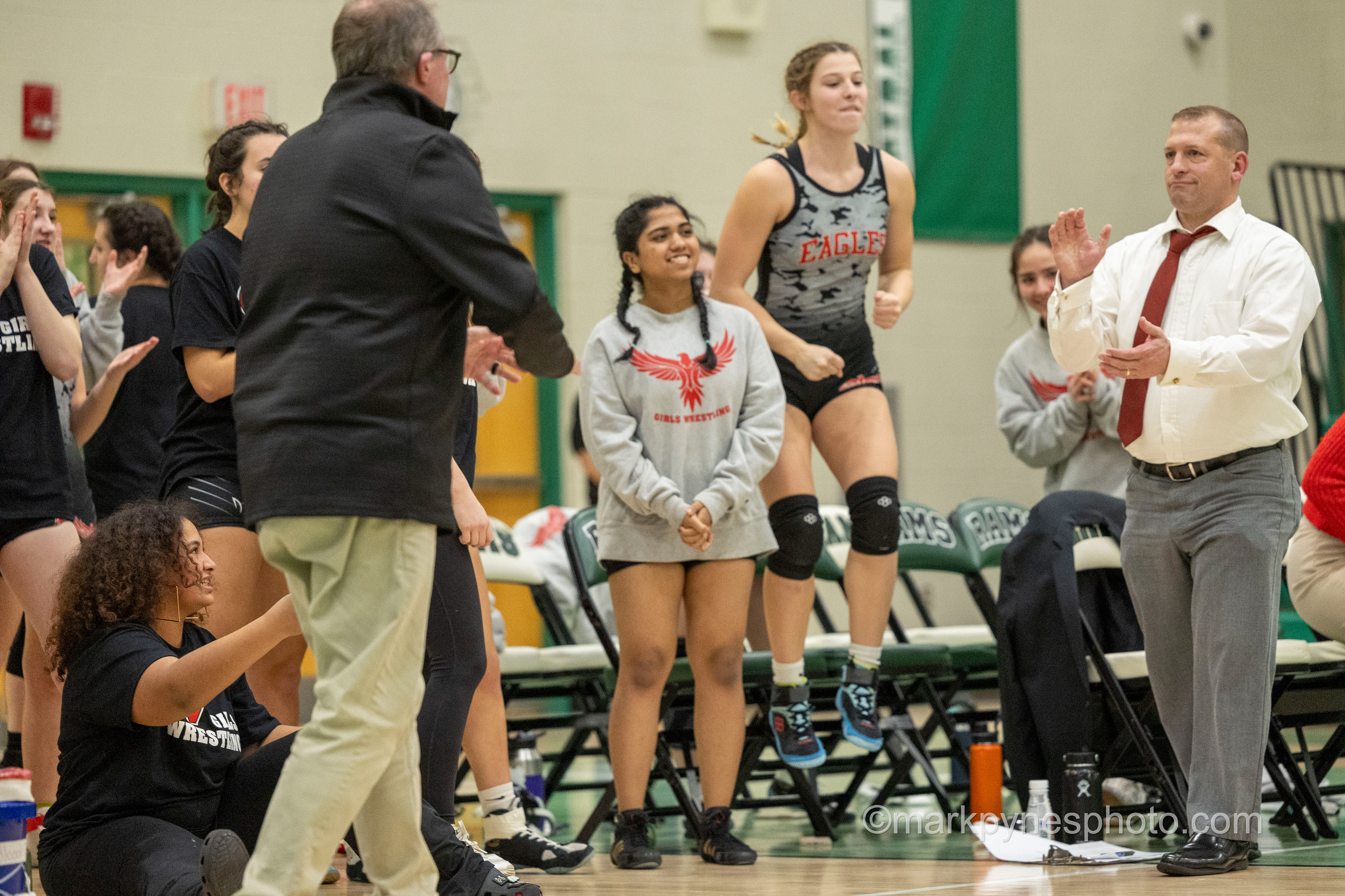 The Cumberland Valley bench celebrates after defeating Central Dauphin, 42-30, in girls wrestling dual meet action in Harrisburg, Pa., Dec. 10, 2024. Photo by Mark Pynes