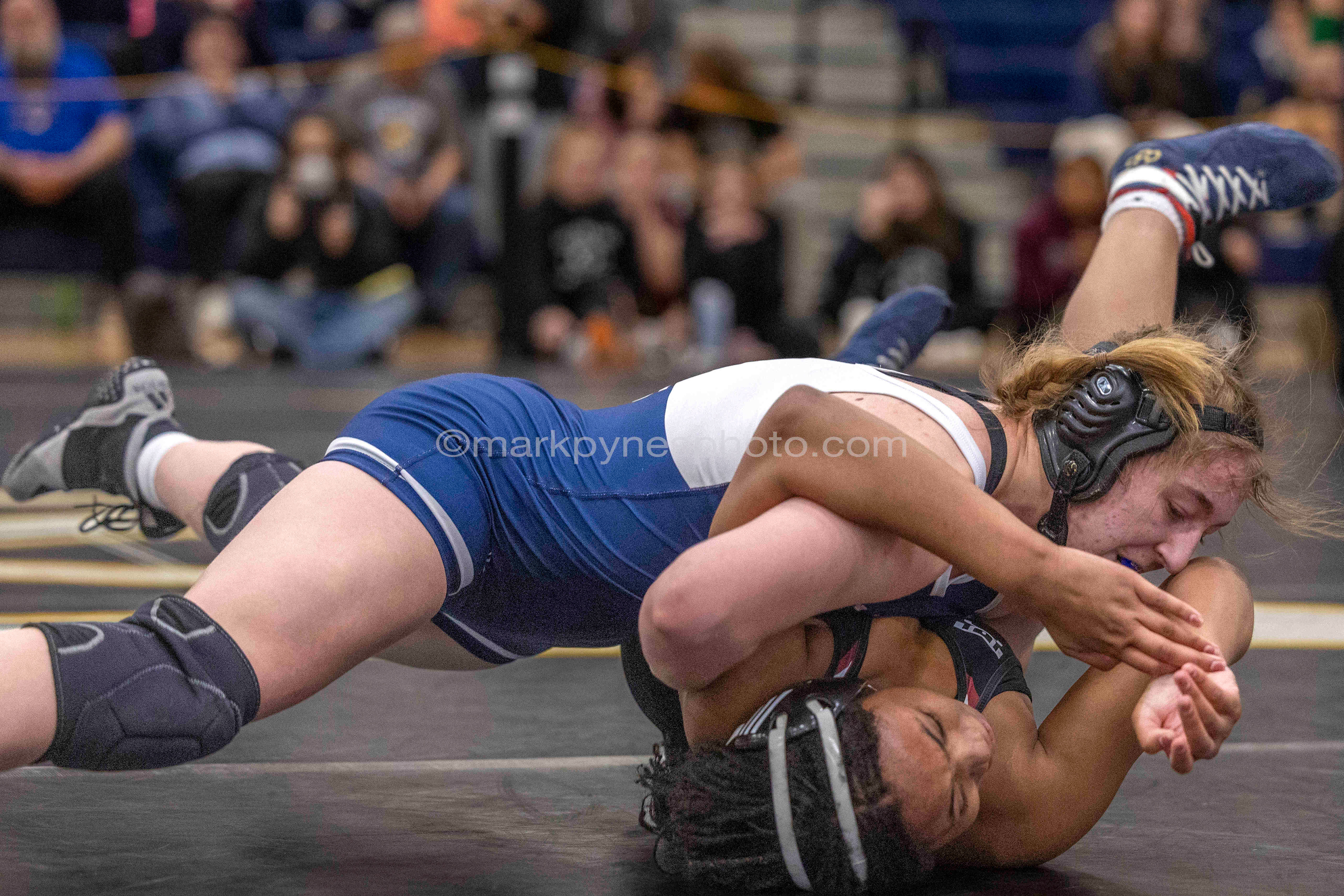 Keeley Nunn, Camp Hill, has Adrianna Bowling, Gettysburg, on her back, but drops the 155-pound final, 12-11.