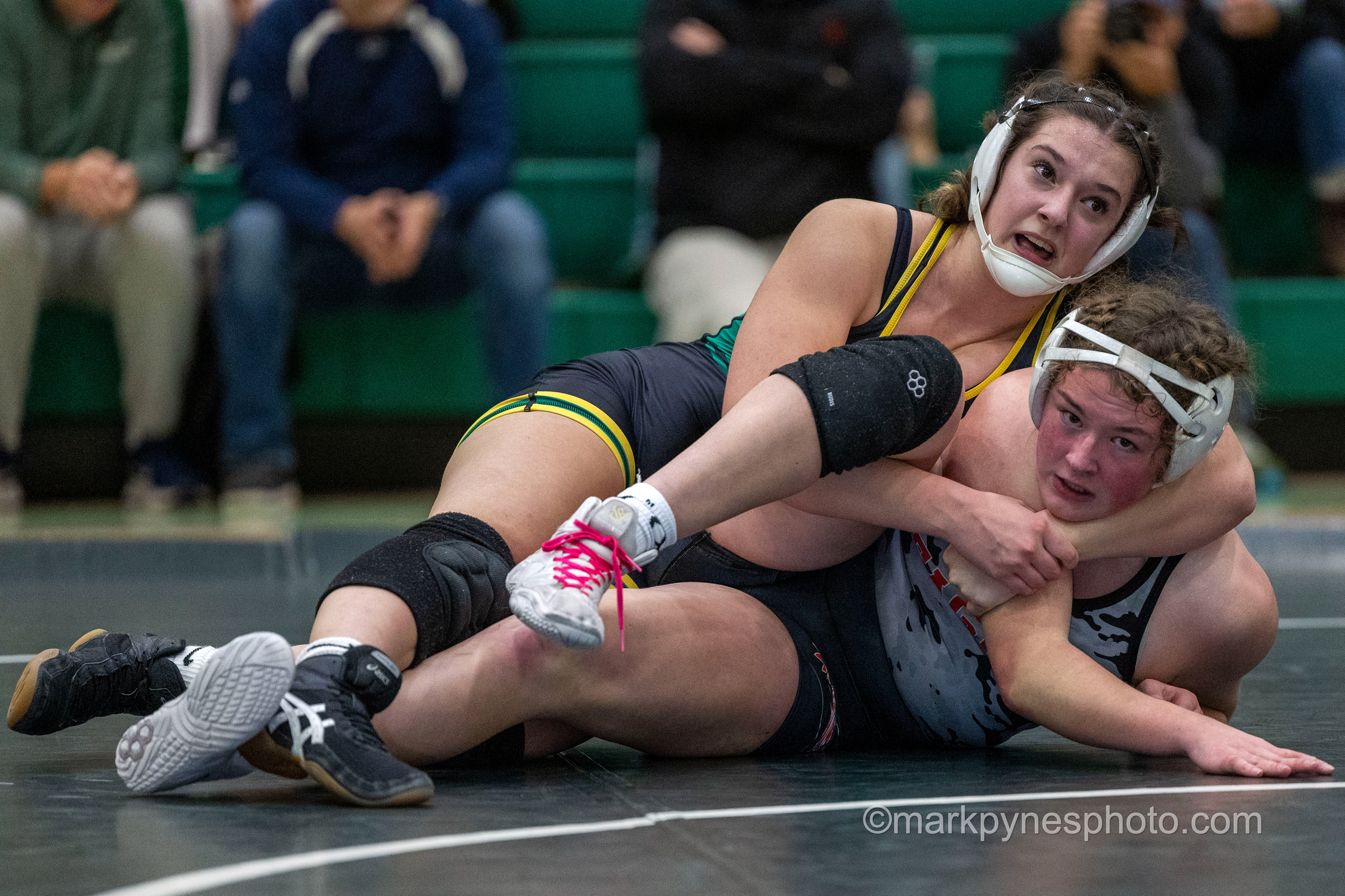 Madison Rife, Central Dauphin, ties up Emma Beaven, Cumberland Valley, in a cradle before losing to her, 7-4, in their 170-pound match.