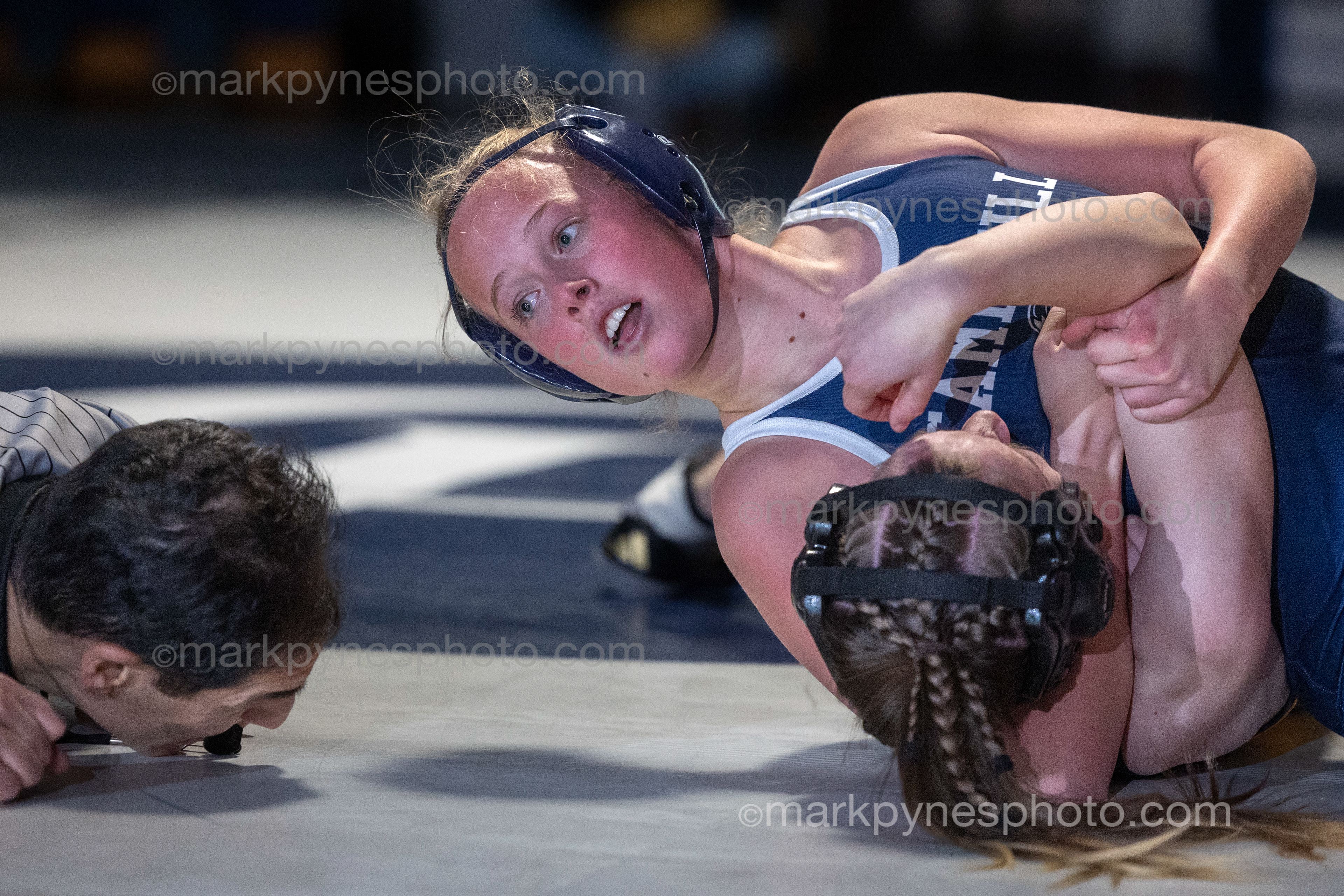Emma Nelson, Camp Hill, pins Alexandra Cannon, Upper Perkioman in the 124-pound match.