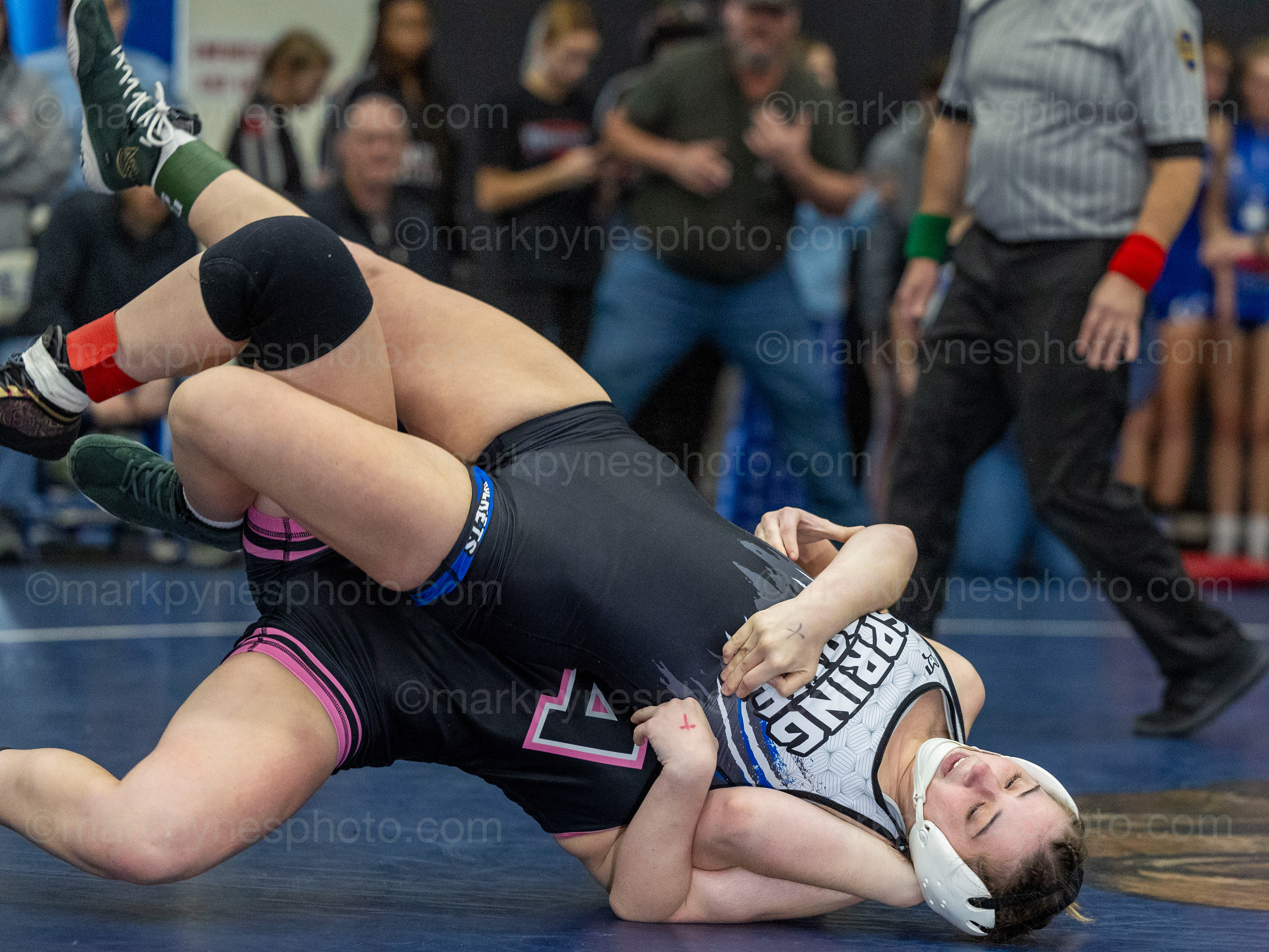 Hanna Rathbun, Athens, throws and pins Spring Grove’s Felicity Davis, in the 130-pound final.