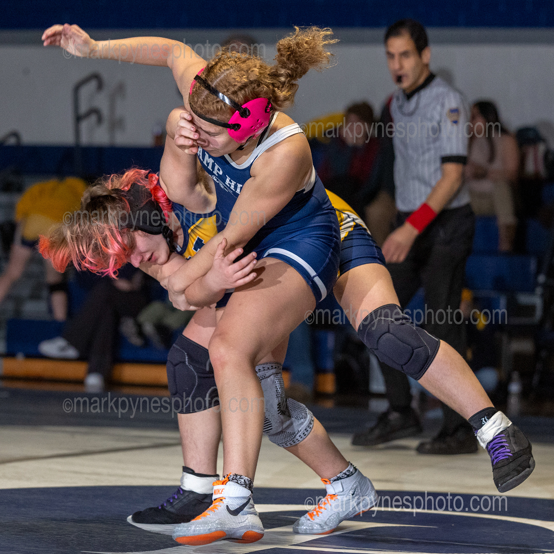 Alisha Hidalgo, Camp Hill’s 148-pounder fights off Upper Perkioman’s Adria Page on the way to a pin at 1:51.