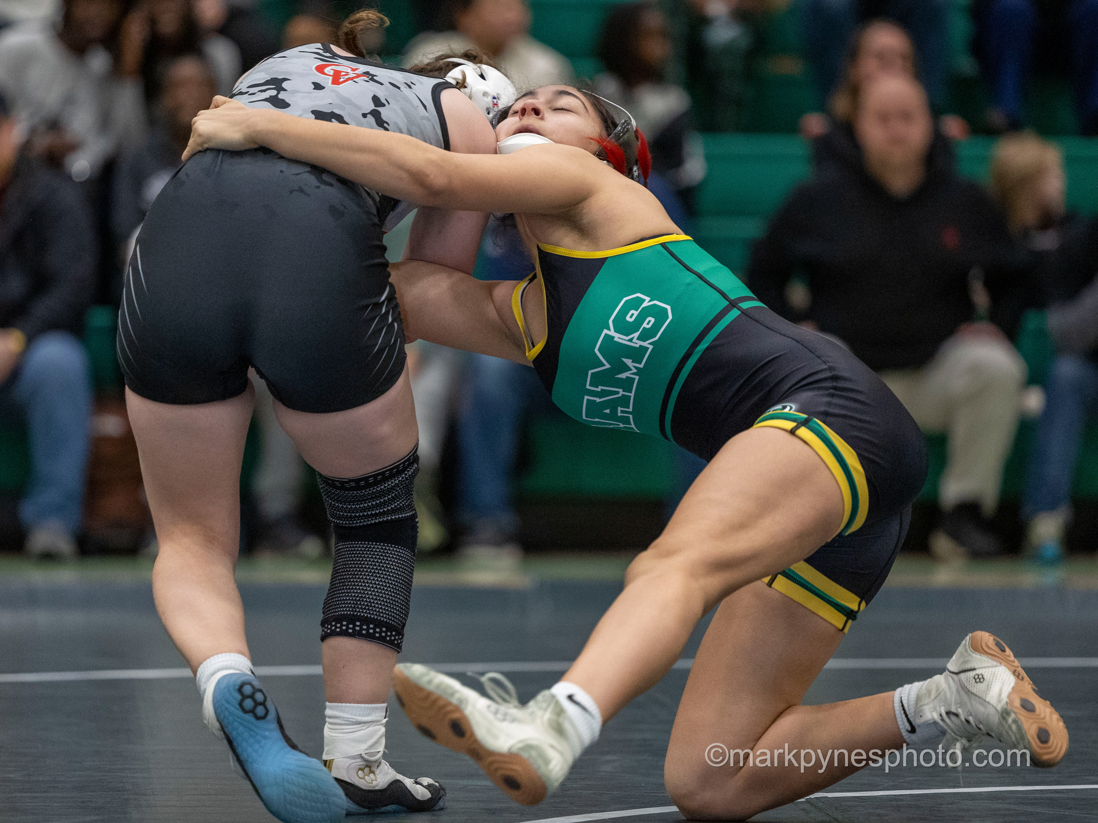 Ana Morales, Central Dauphin, tries to hold on to Lillian Seagreaves, Cumberland Valley, in their 118-pound match, won by Seagreaves in a surprise fall.