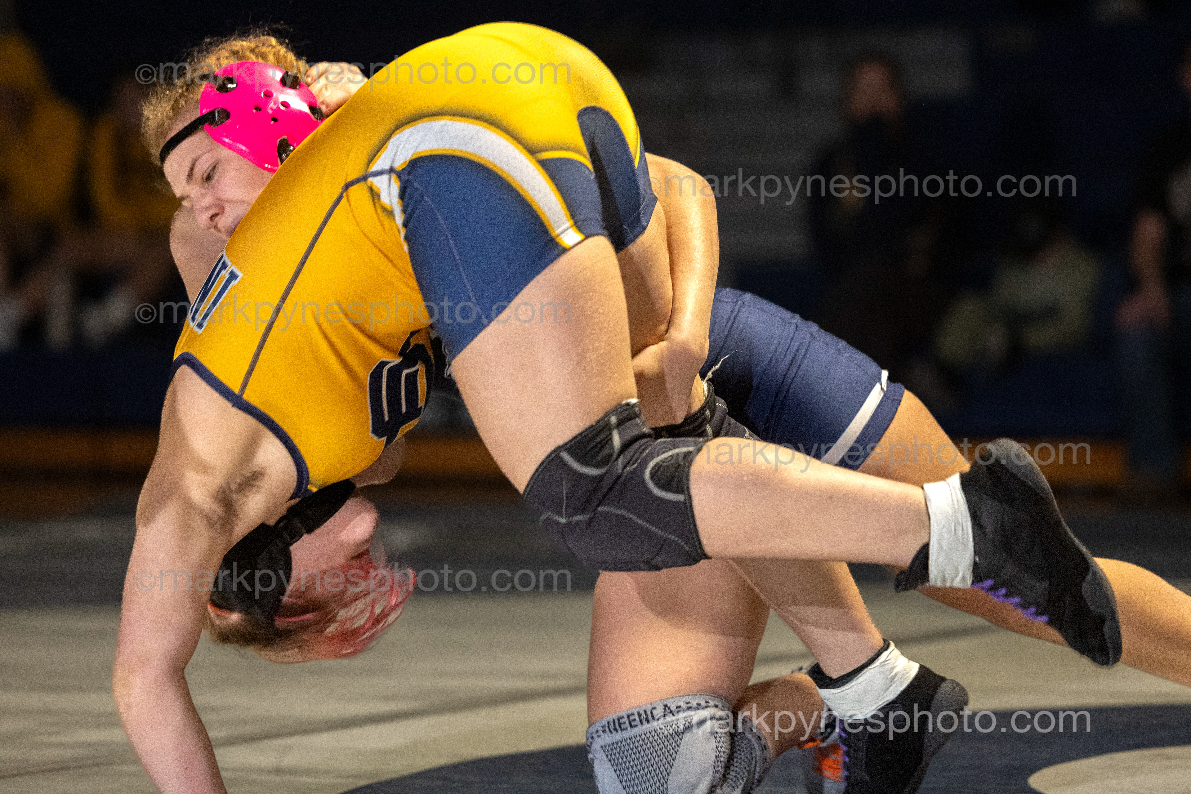 Alisha Hidalgo, Camp Hill’s 148-pounder throws Upper Perkioman’s Adria Page on the way to a pin at 1:51.