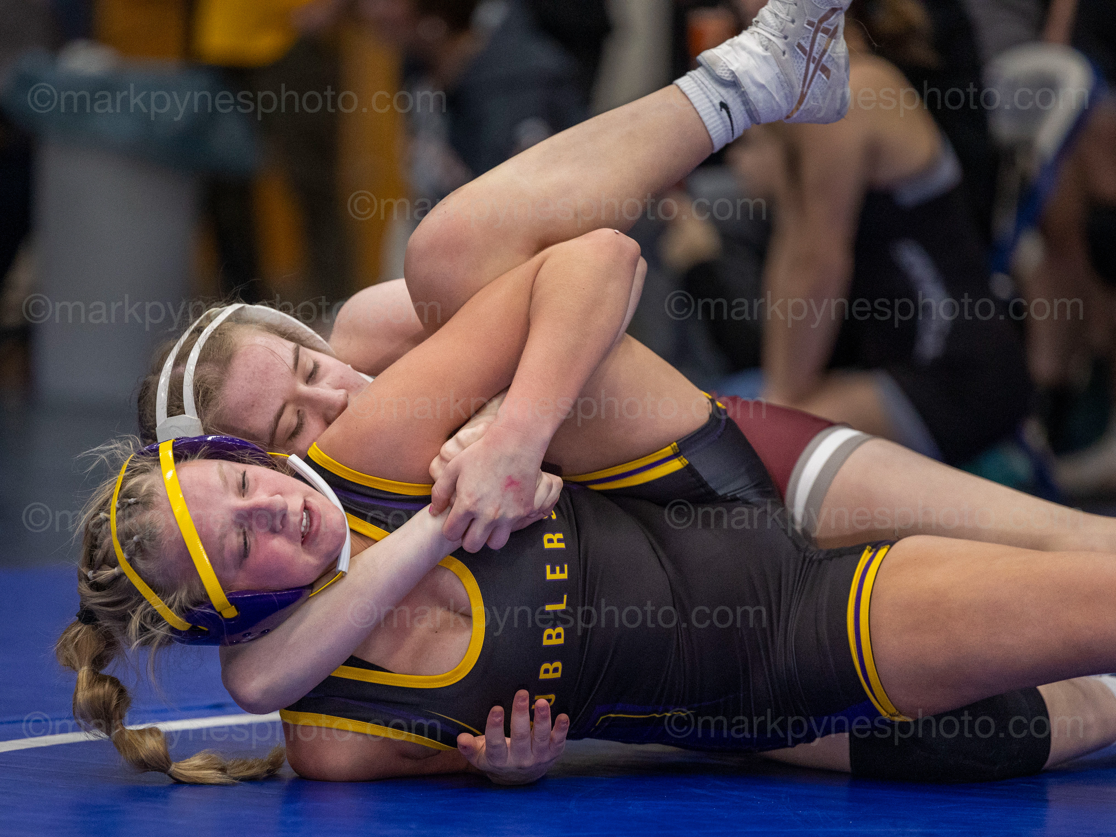 Kallie Bower, Mechanicsburg, goes for a cradle on Boiling Springs’ Molly Sowers, on the way to a 15-0 tech. fall in the 130-pound third place final.