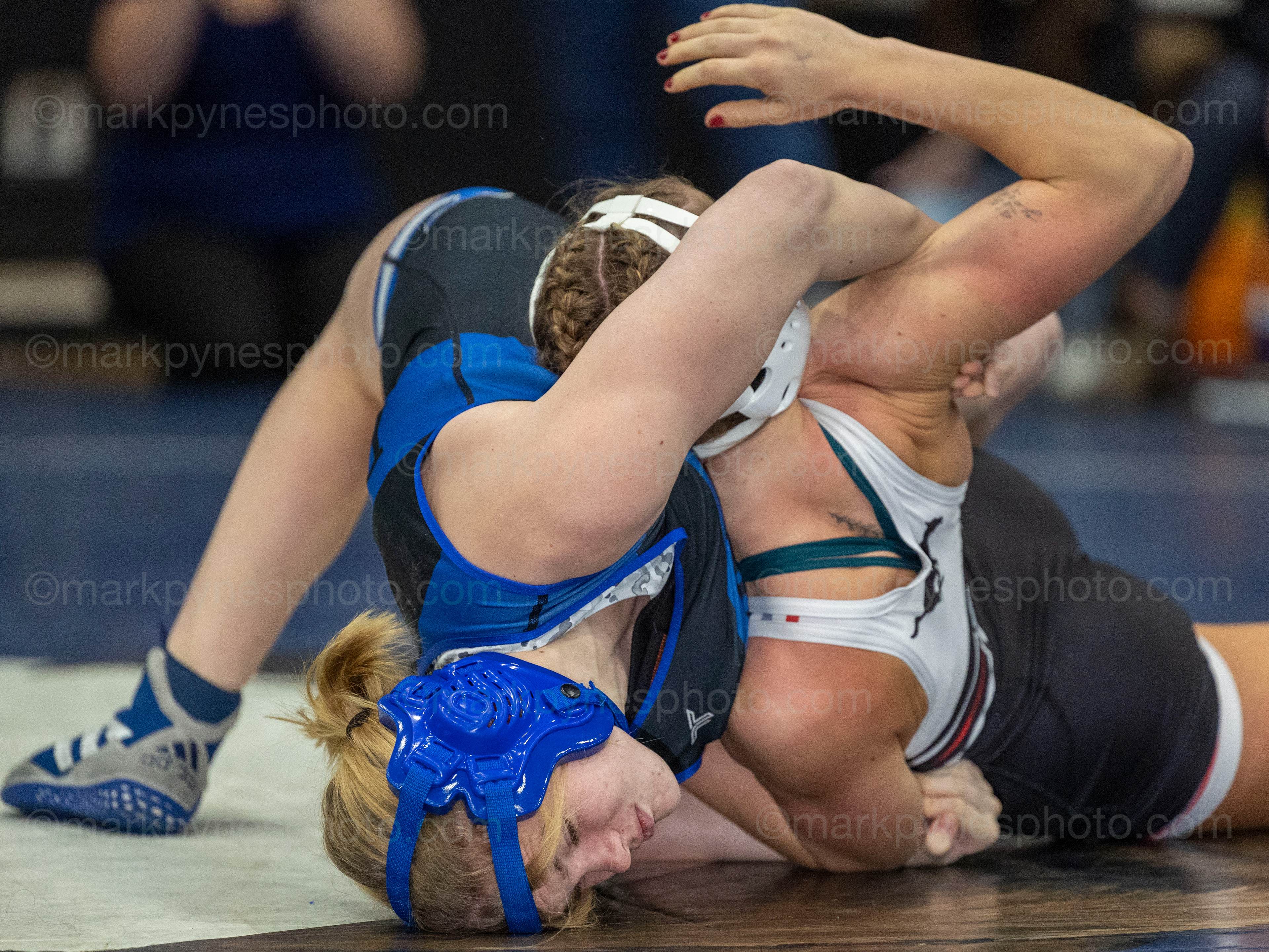 Elizabethtown’s Gracie Woodring and Tatum Duckworth, Souther Western, grapple for position in the 124-pound final.
