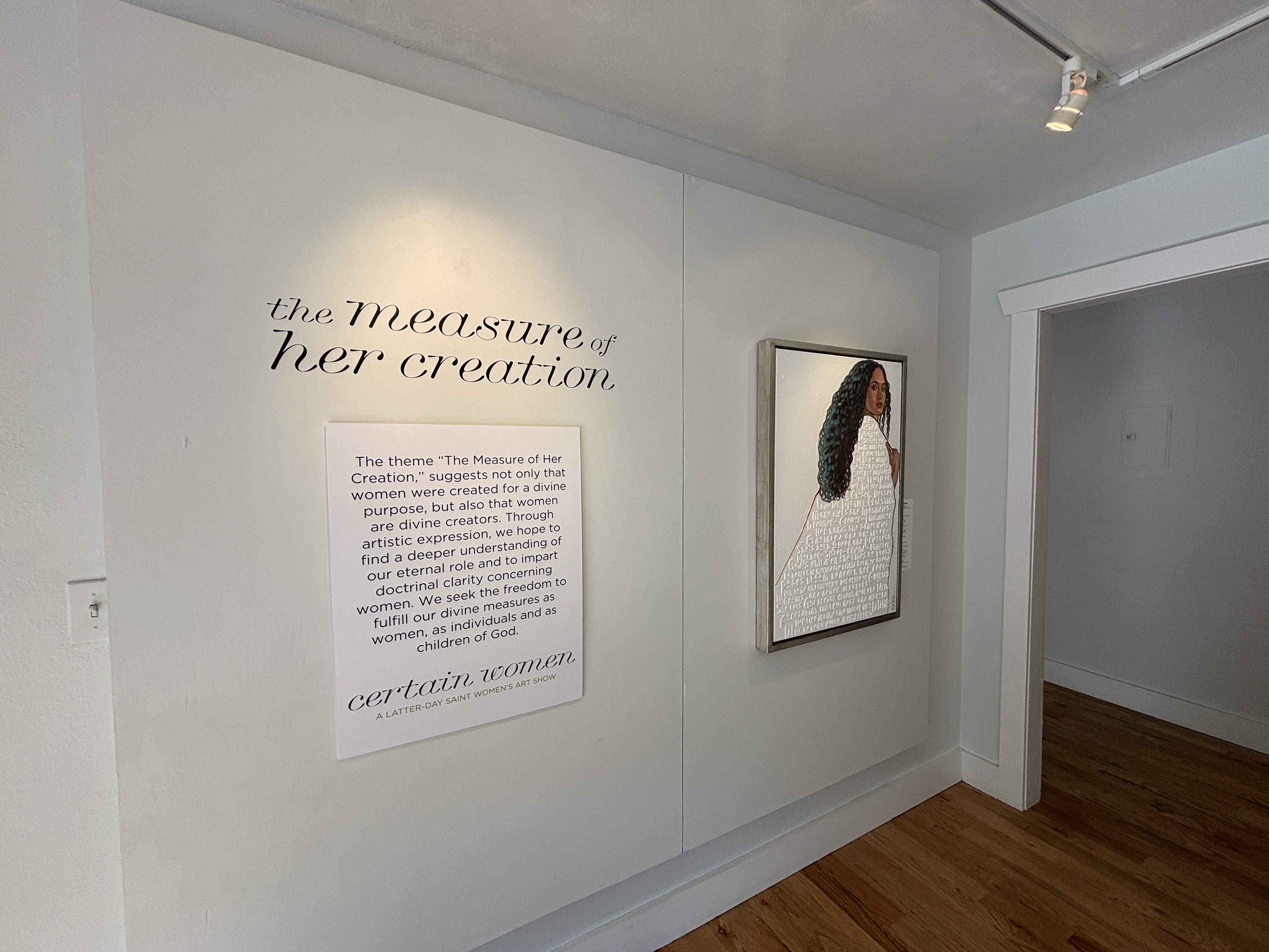 Logotype and show statement displayed at gallery entrance