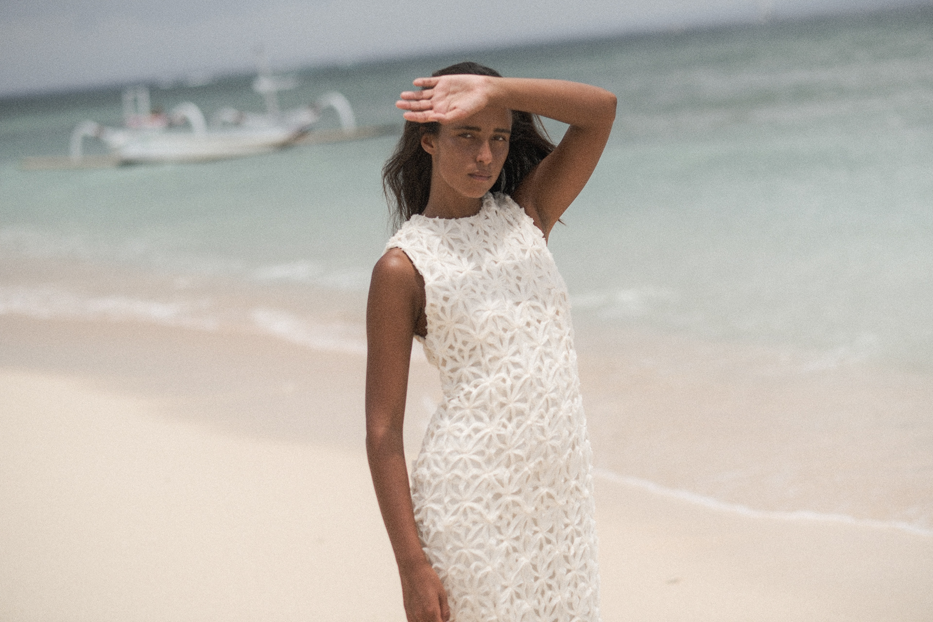 White textured dress against the sea
