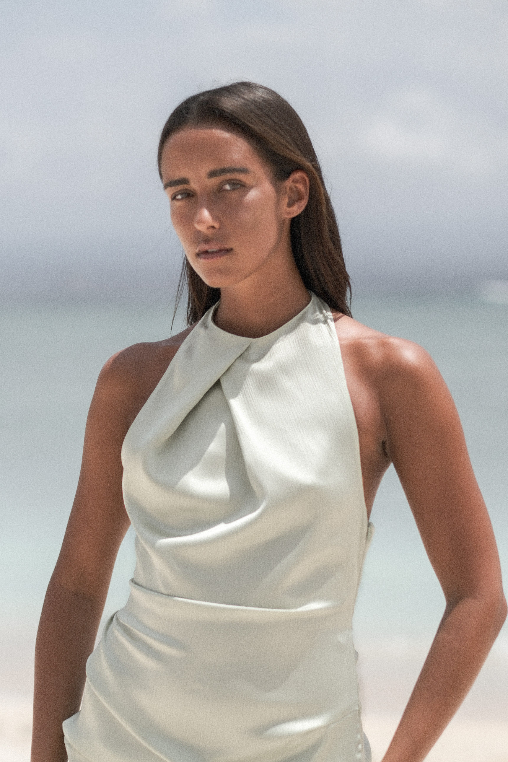 Portrait in a white halter dress