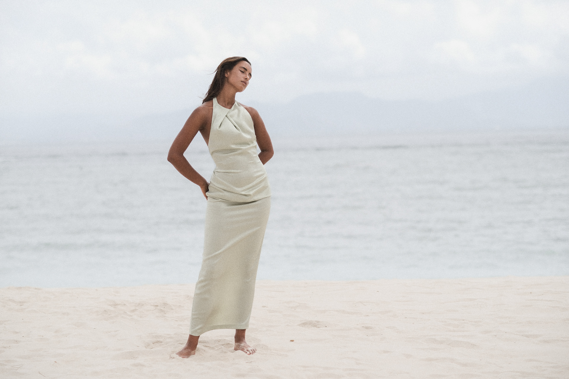White halter dress against the ocean