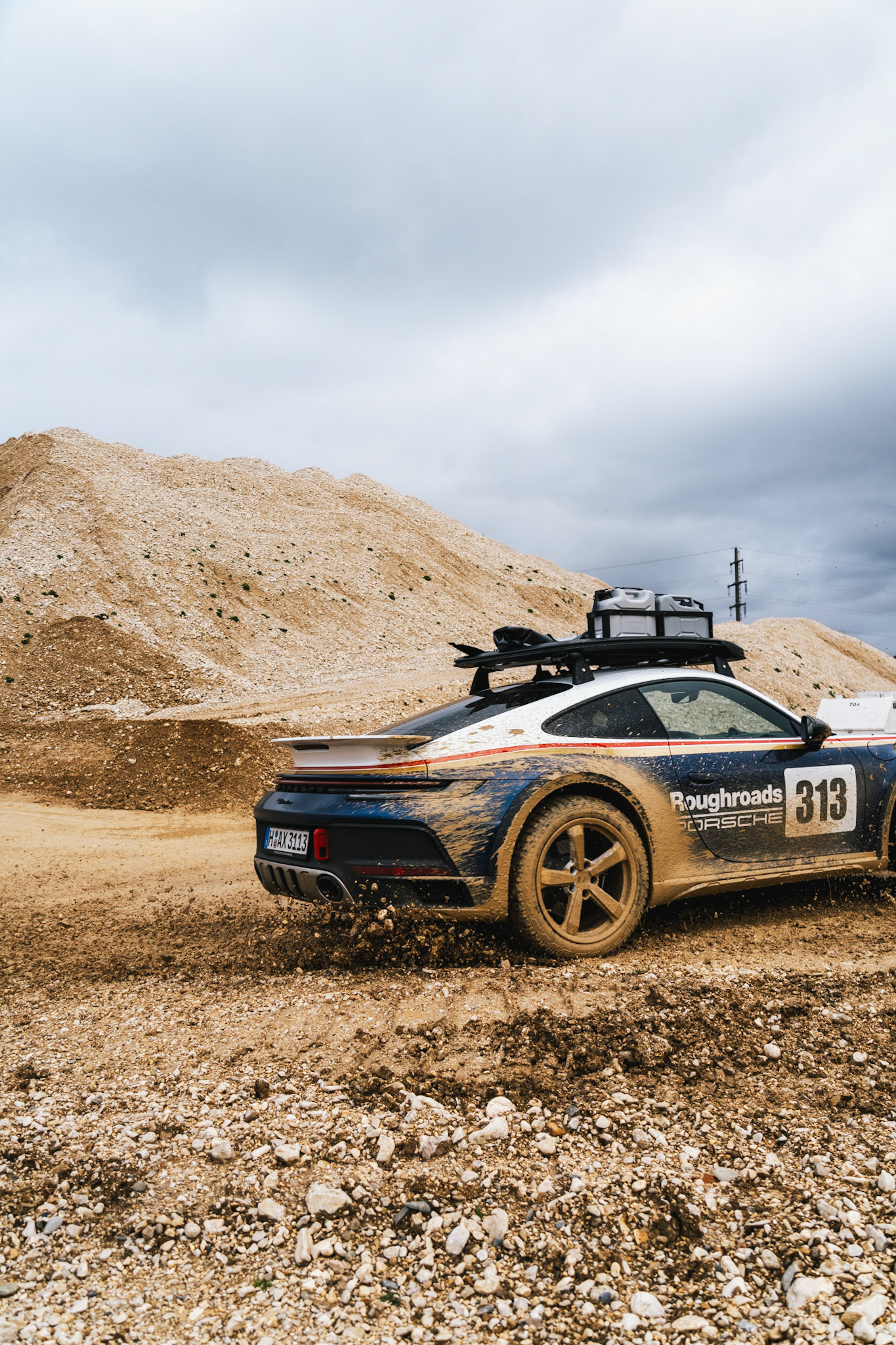on our road trip from hanover to barcelona with the new porsche 911 dakar, we found a gravel pit in the french-speaking part of switzerland. we just asked if we could test the car a bit... we were allowed to and it was a lot of fun to photograph...