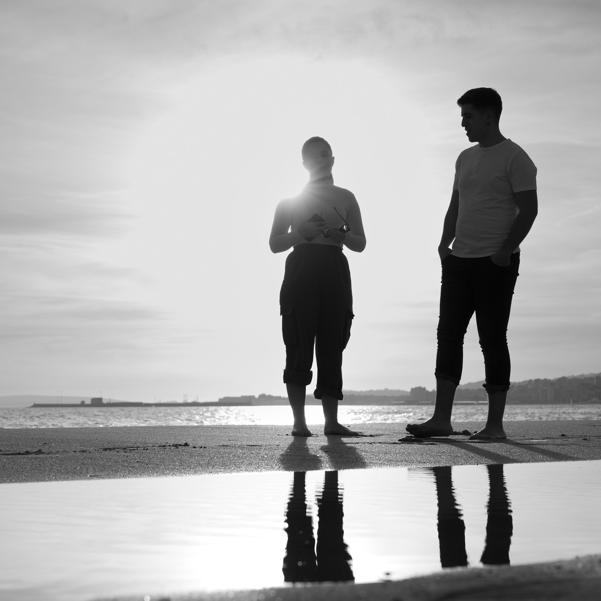 at the city beach of palma, two figures are etched against the softening light of dusk. they stand close, their silhouettes merging with the shimmering reflection on the wet sand, a testament to the intimate bond they share. this image, aptly named "couple," captures the essence of companionship in its most simplistic form — two individuals, together, against the vast backdrop of the sea and sky. it's a scene that resonates with the quiet power of connection and the shared serenity found at the water's edge.