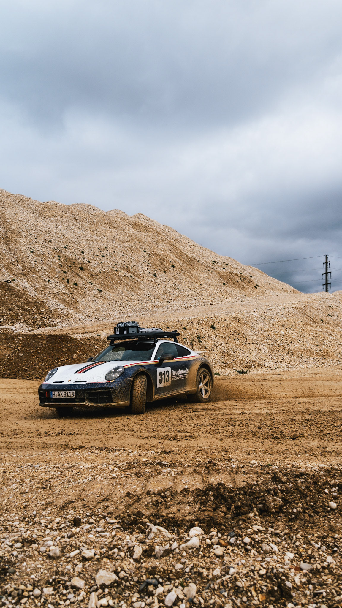 on our road trip from hanover to barcelona with the new porsche 911 dakar, we found a gravel pit in the french-speaking part of switzerland. we just asked if we could test the car a bit... we were allowed to and it was a lot of fun to photograph...