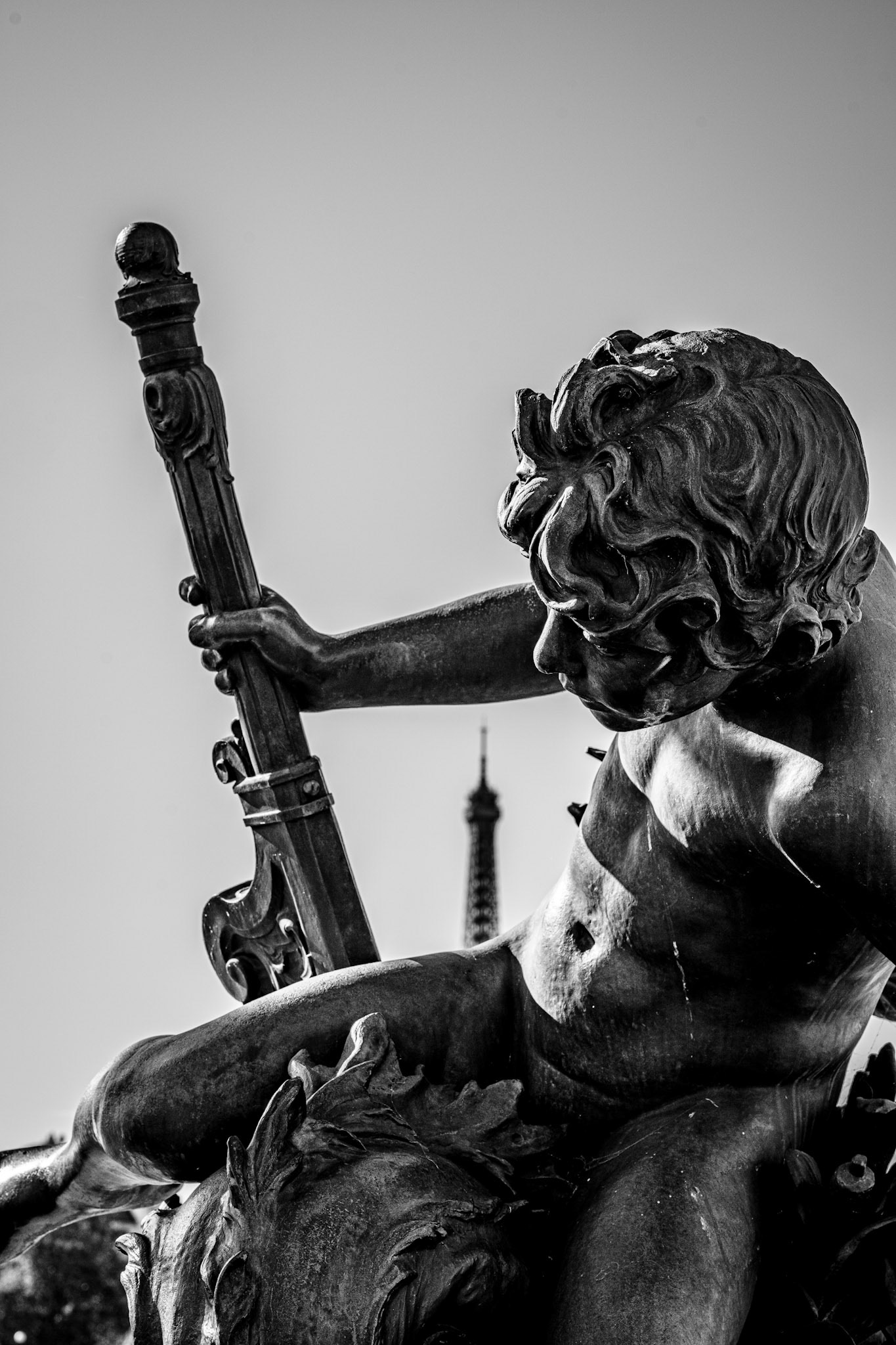 on the pont alexandre iii, this cherubic figure brings to life the bridge’s spirit of french grandeur and artistic legacy. positioned against the iconic eiffel tower, it’s as if this bronze guardian watches over the city, embodying the beauty and timeless allure of paris. pont alexandre iii, completed in 1900, is celebrated for its elegance and serves as a link not just between the banks of the seine but between art and history, past and present.
