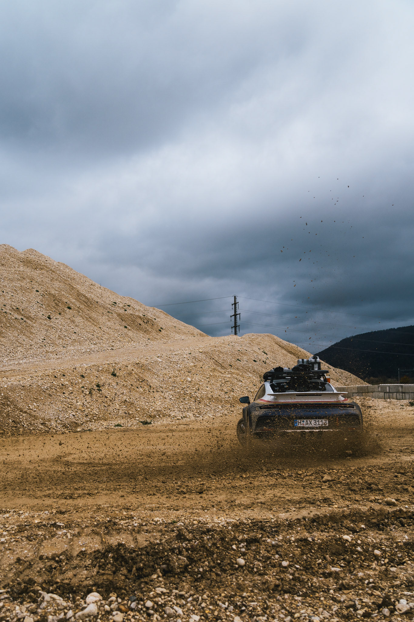on our road trip from hanover to barcelona with the new porsche 911 dakar, we found a gravel pit in the french-speaking part of switzerland. we just asked if we could test the car a bit... we were allowed to and it was a lot of fun to photograph...