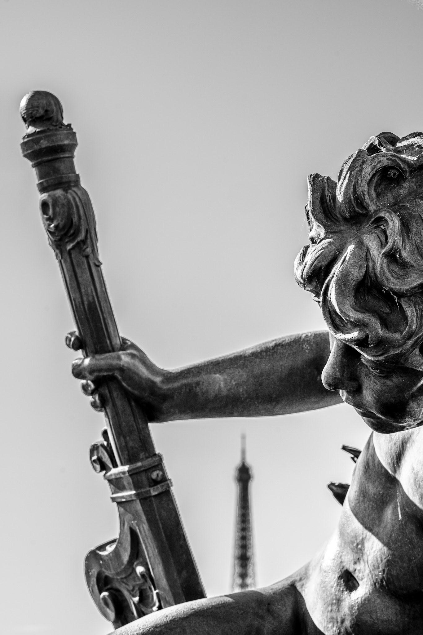 captured on pont alexandre iii, this statue represents one of the cherubs that guard the iconic parisian bridge. with the eiffel tower quietly in the background, the scene merges history, art, and the spirit of paris itself. the cherub, part of pont alexandre iii’s extravagant sculptures, reminds us of the city’s artistic dedication and timeless allure.
