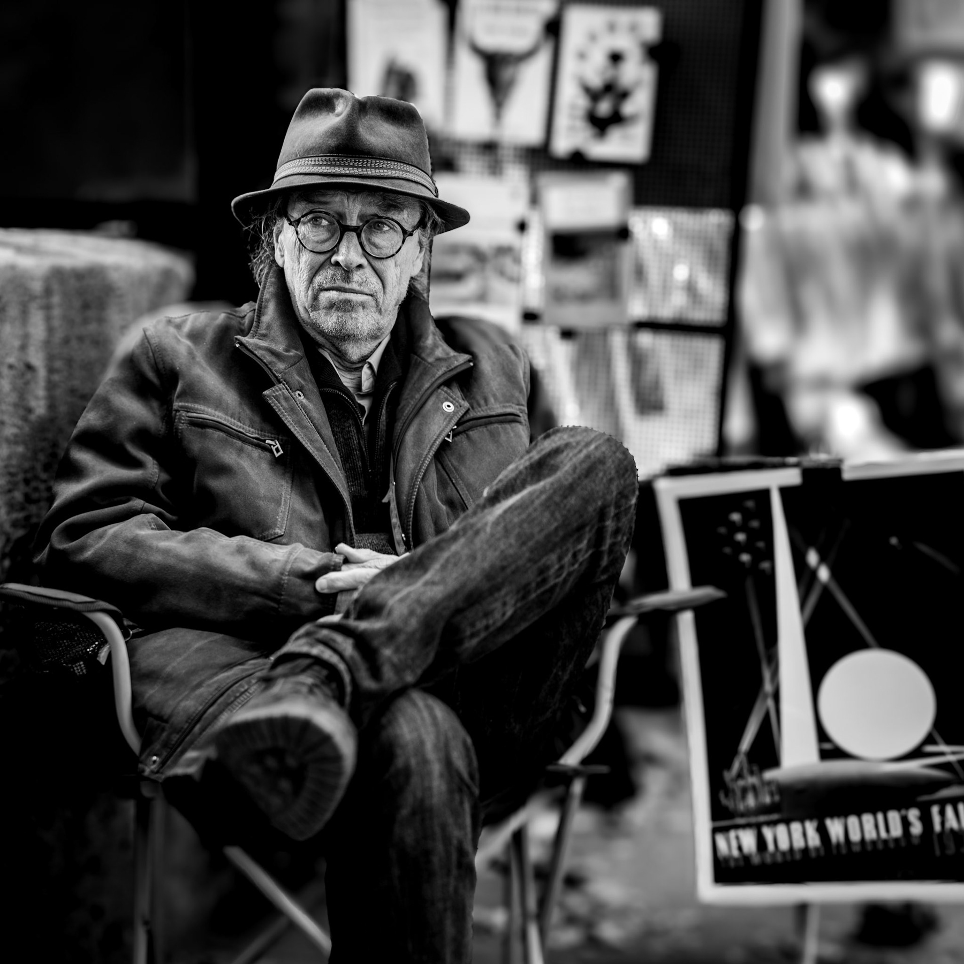 there’s a quiet charm in the timelessness of the bouquinistes of paris. once guardians of books, they now curate nostalgia—posters from another era, magazines with forgotten headlines, and a sense of permanence in an ever-changing city. this man, with his steady gaze and relaxed posture, seems almost like a relic himself, embodying the calm resilience of his trade. fallen leaves frame the scene, as if autumn itself has paused to pay respect to a tradition slowly evolving, yet refusing to fade.